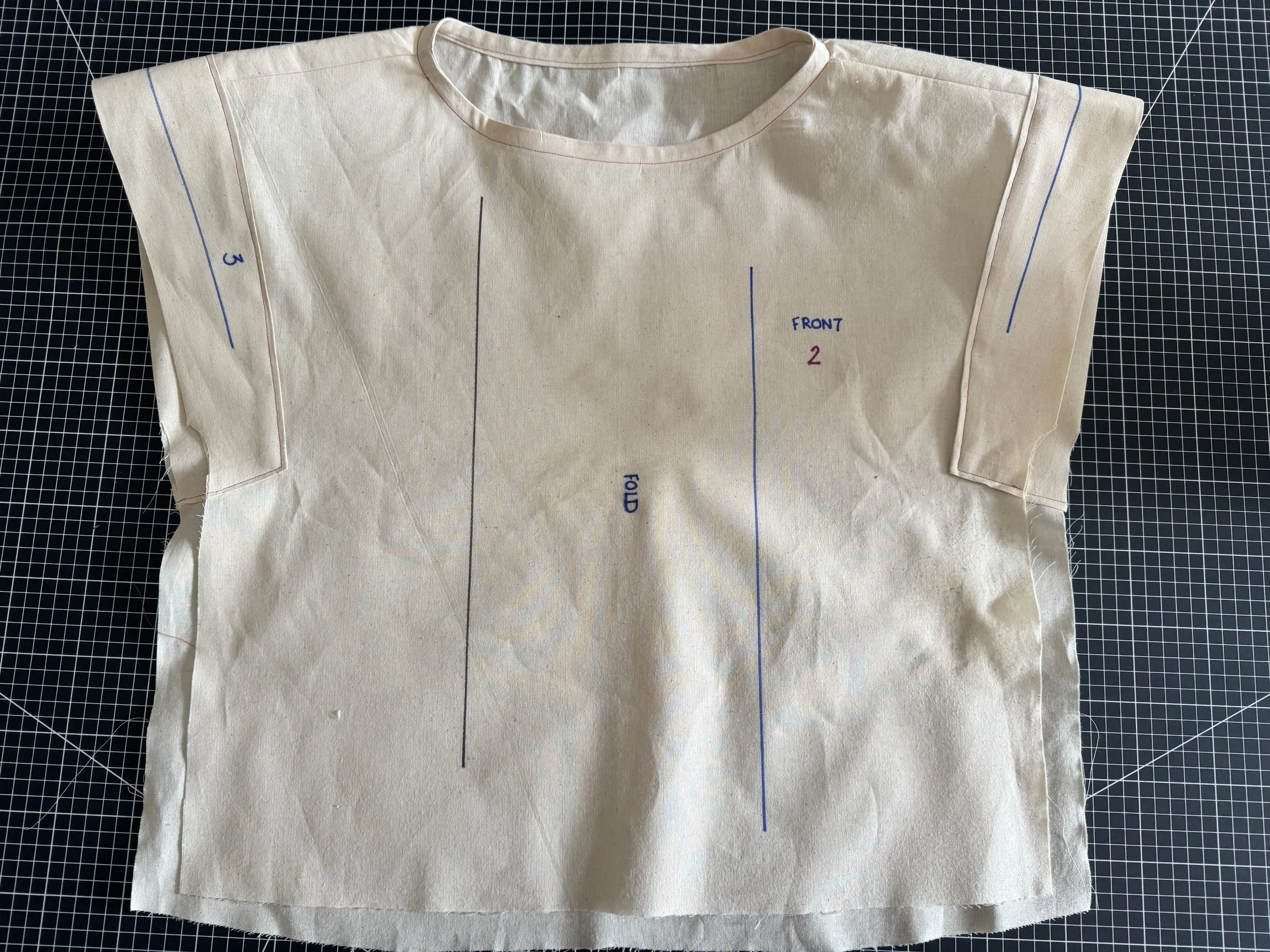 Flip your bodice, face up as shown.  Start to match the two sleeve seam lines.  The front shoulder seams fall towards the front.