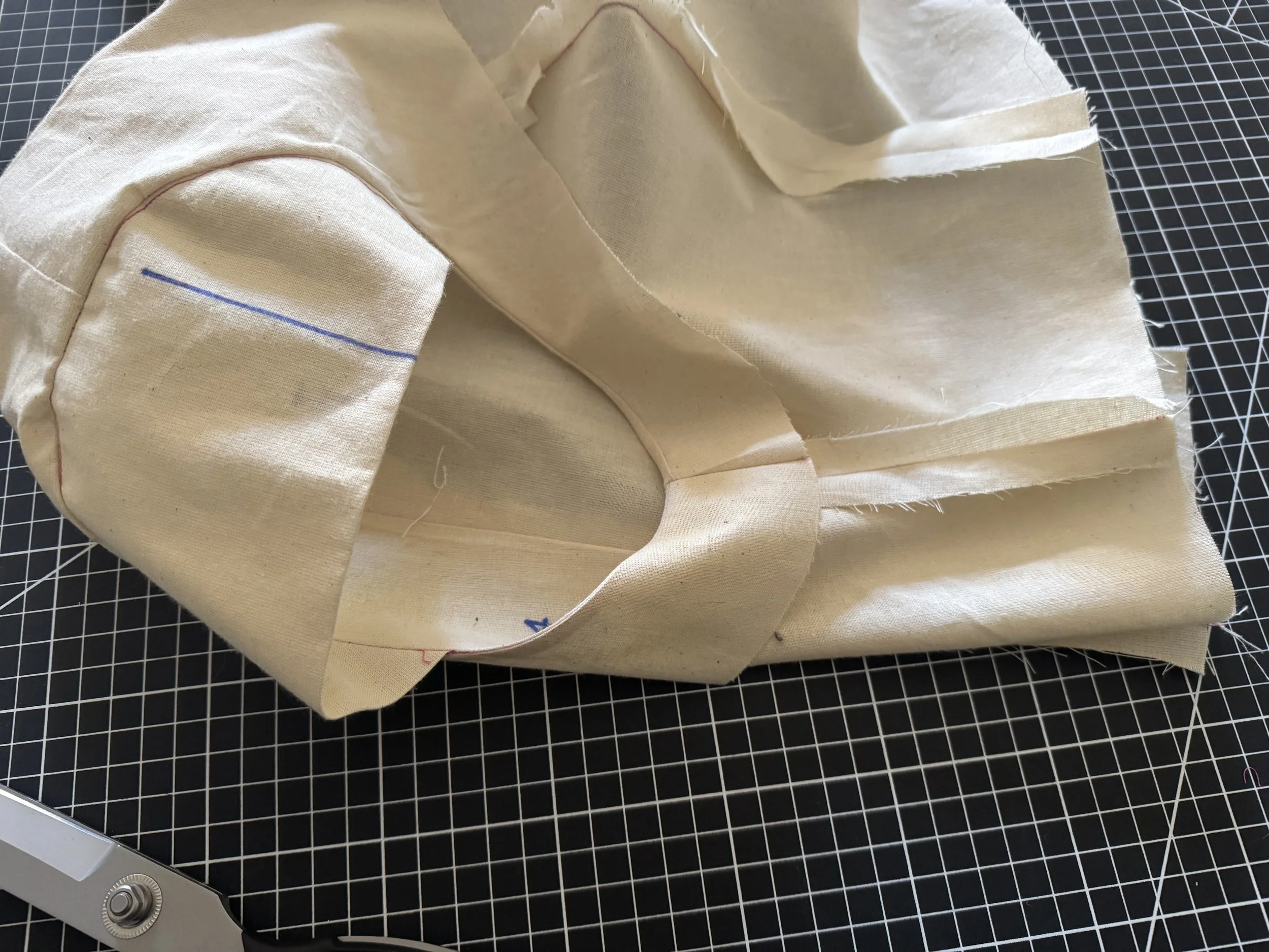  To hold the facing at the side seam, I’ll add a quick hand stitch - double thread in a matching colour. 