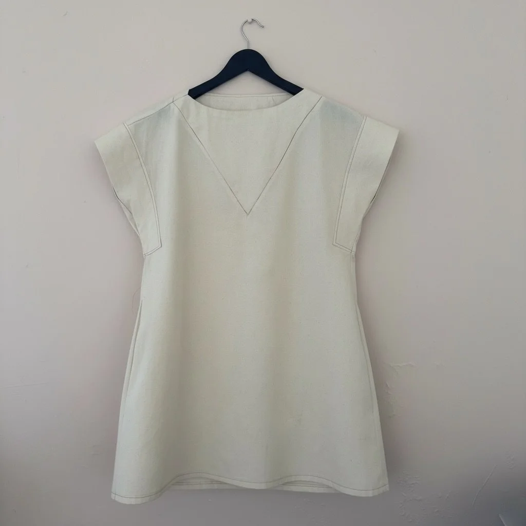 If you enjoyed sewing Iris A, Iris B as shown in muslin above, has the same sleeve method, and dress pockets, along with optional shoulder tabs and an inset corner V-point seam on both the front and back yoke for some additional skill building….