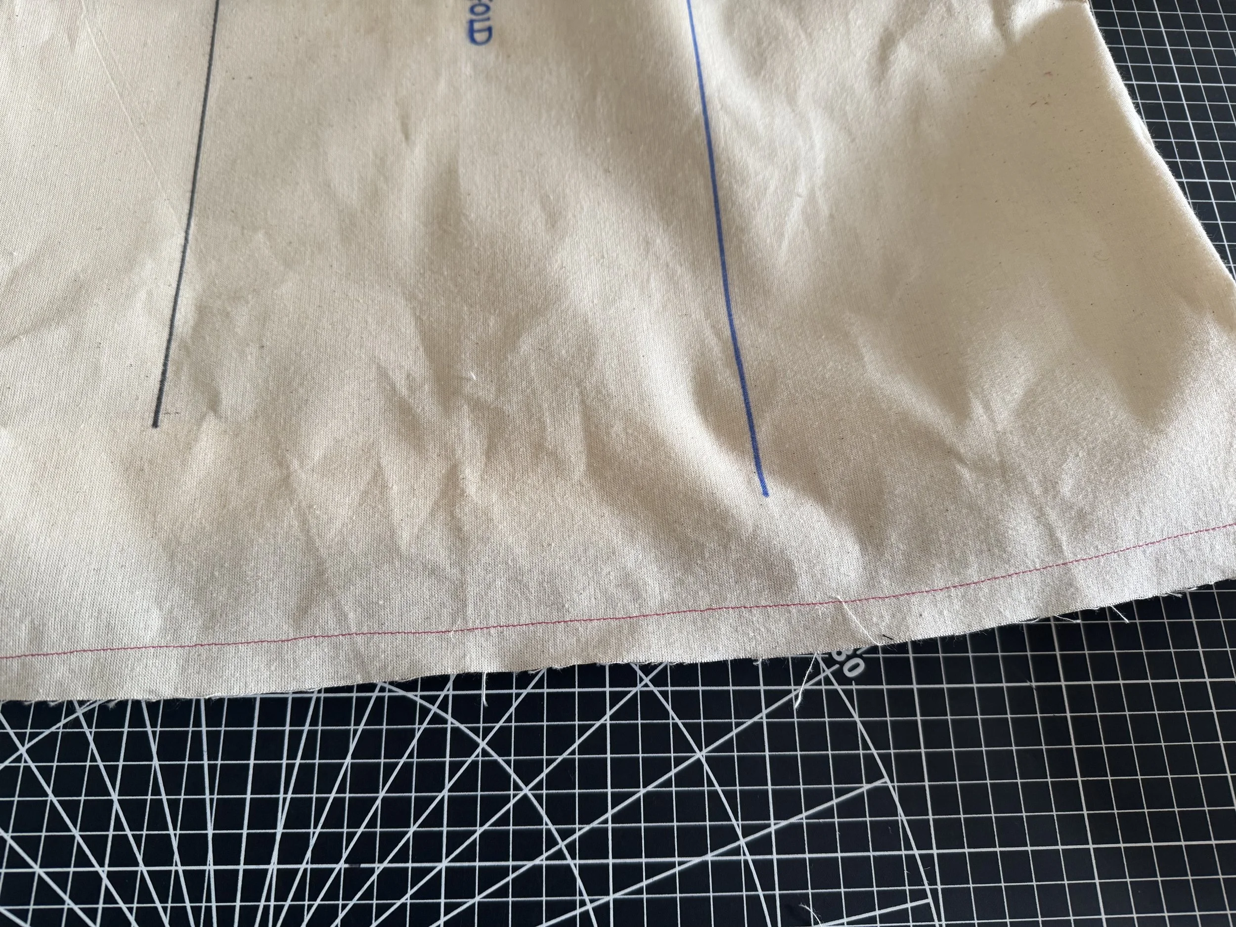 To finish the hem, stitch a 5/8” seam line along the edge as shown above.