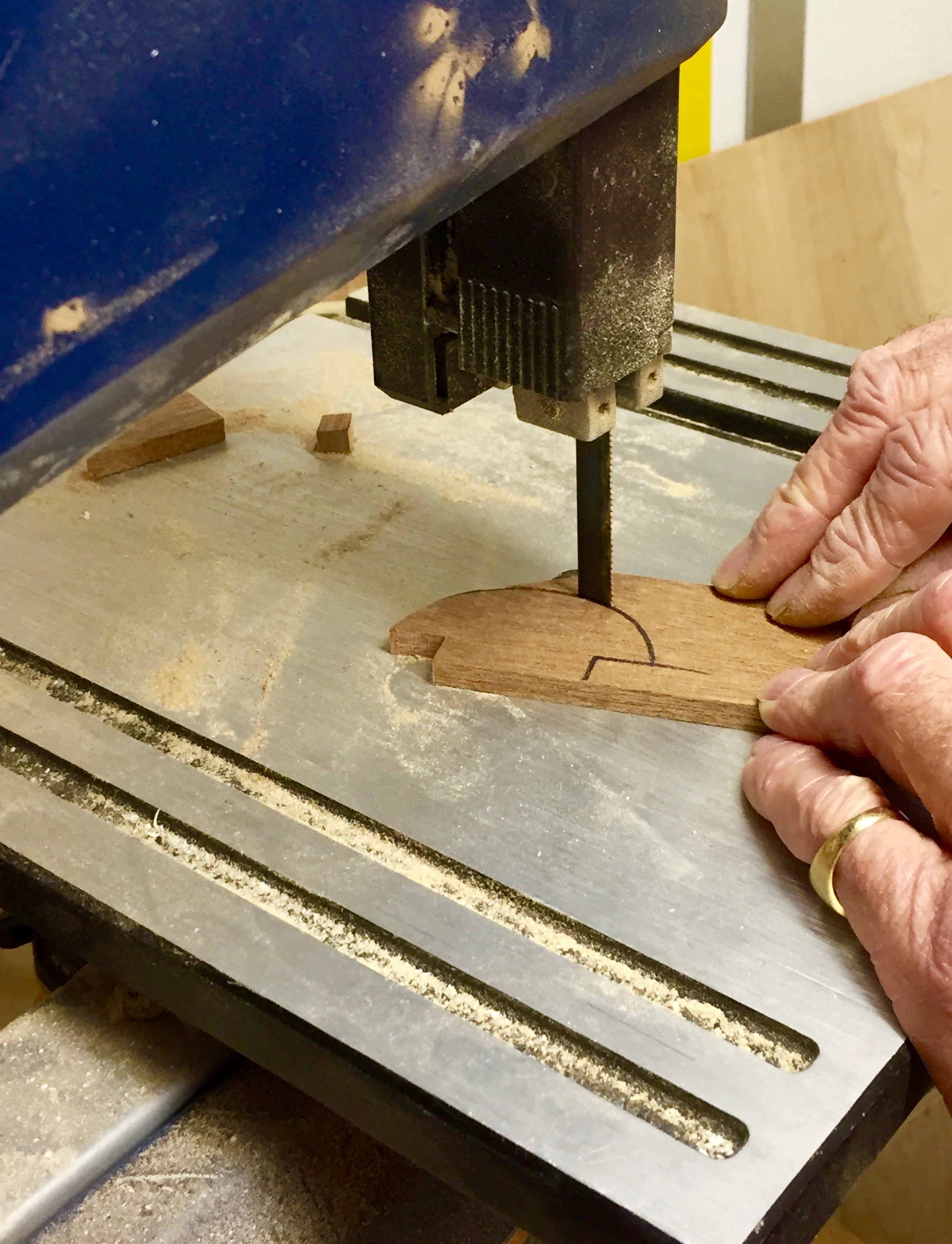  Cutting mahogany handles for Mardi Gras cabinets. 