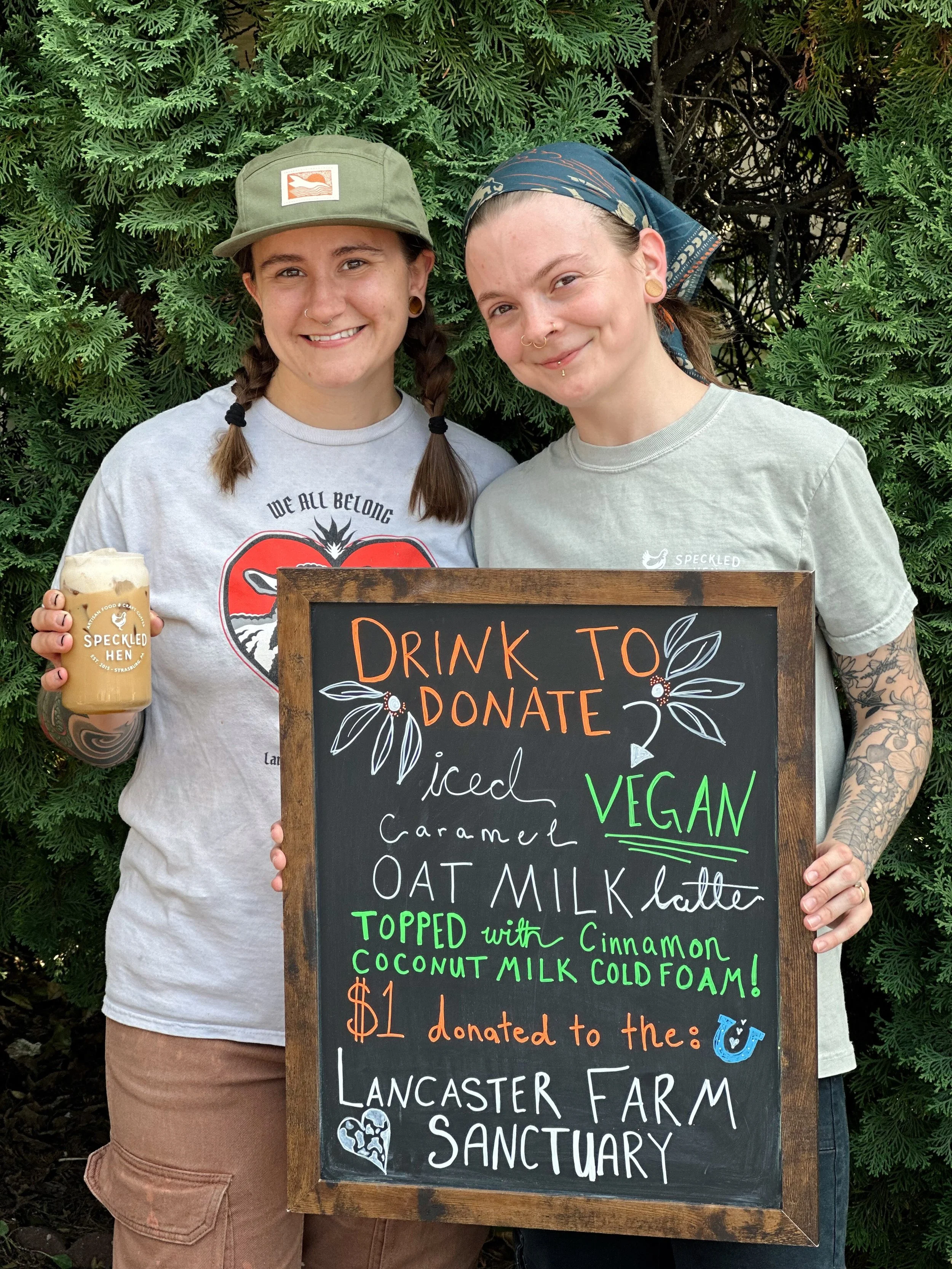 Our favorite Vegans, aka Faith, Lead Baker &amp; Kat on our prep/catering team, are excited to introduce you to their Drink To Donate creation for this month! Come try their completely vegan Caramel Iced Latte topped with a decadent Cinnamon Coconut 