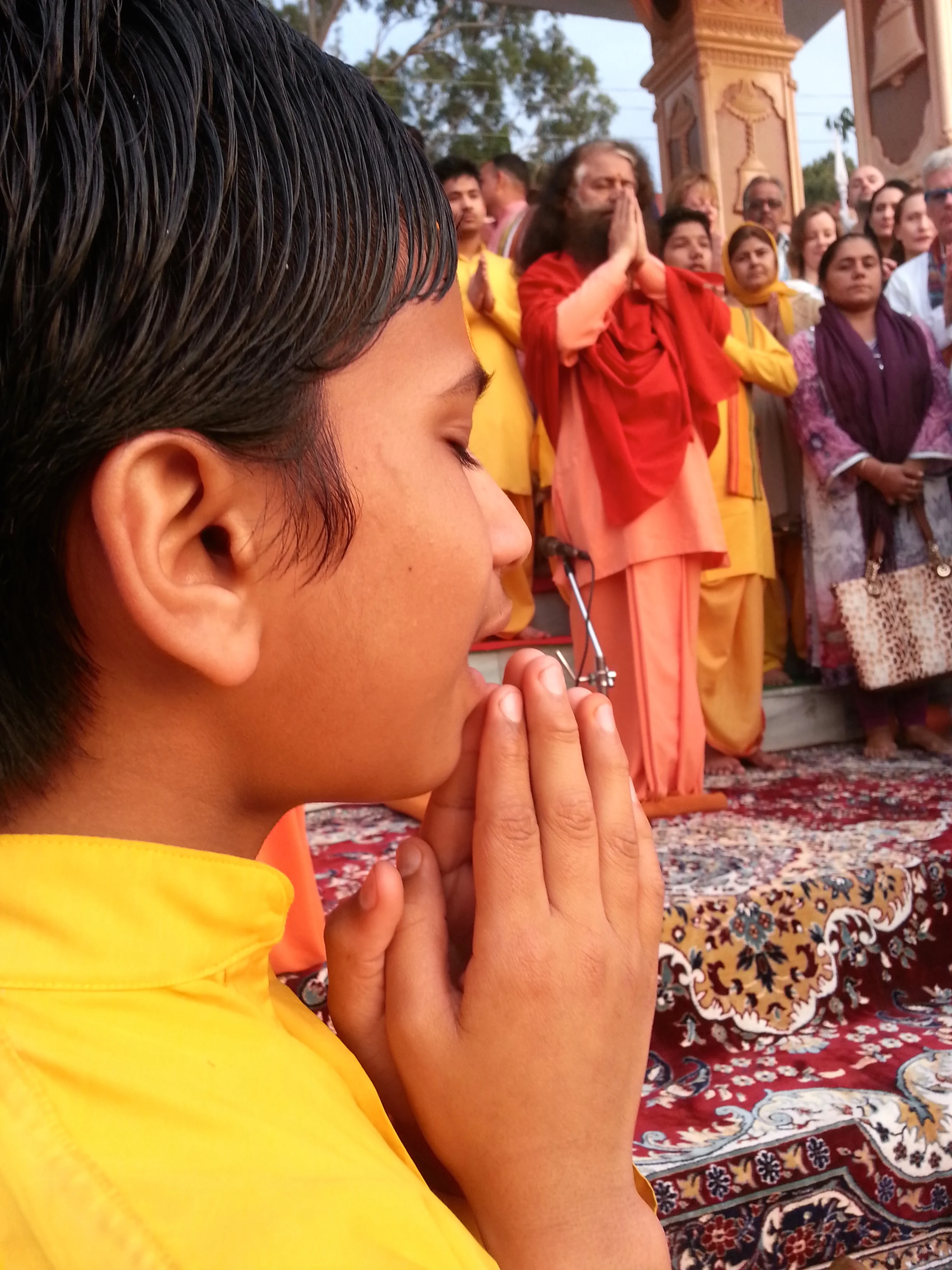Hindu devotees sing and pray along the Ganges River.