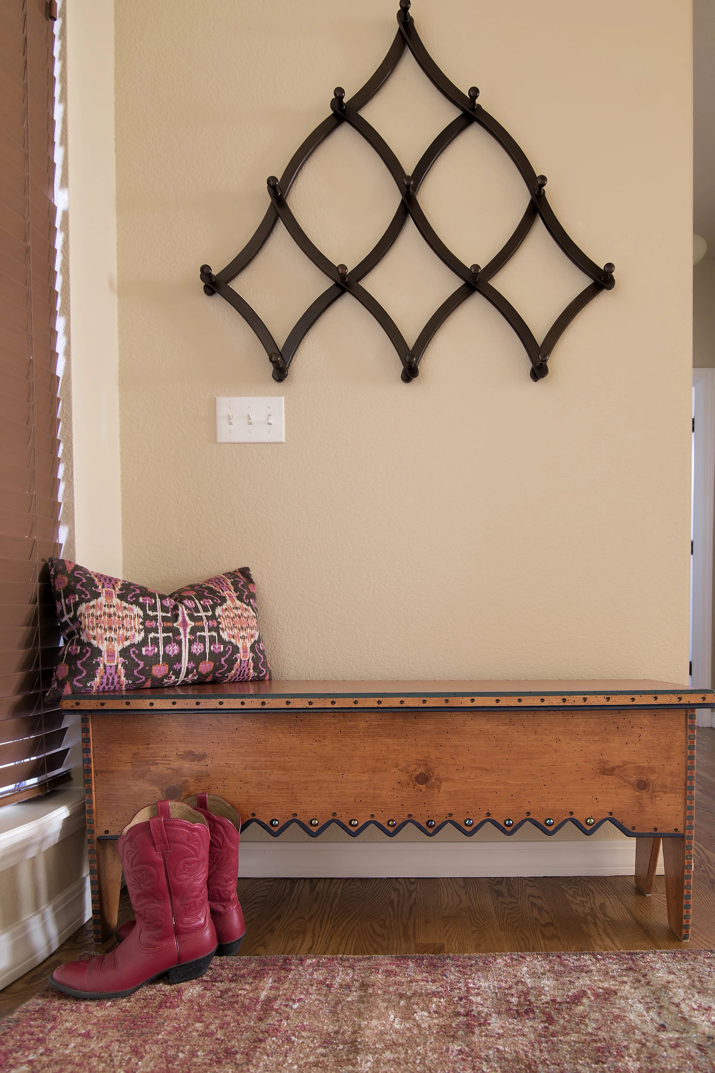 This bench belonged to our client before we came on to the project. We added the coat rack and lovely rug from Loloi to create a functional and welcoming foyer.