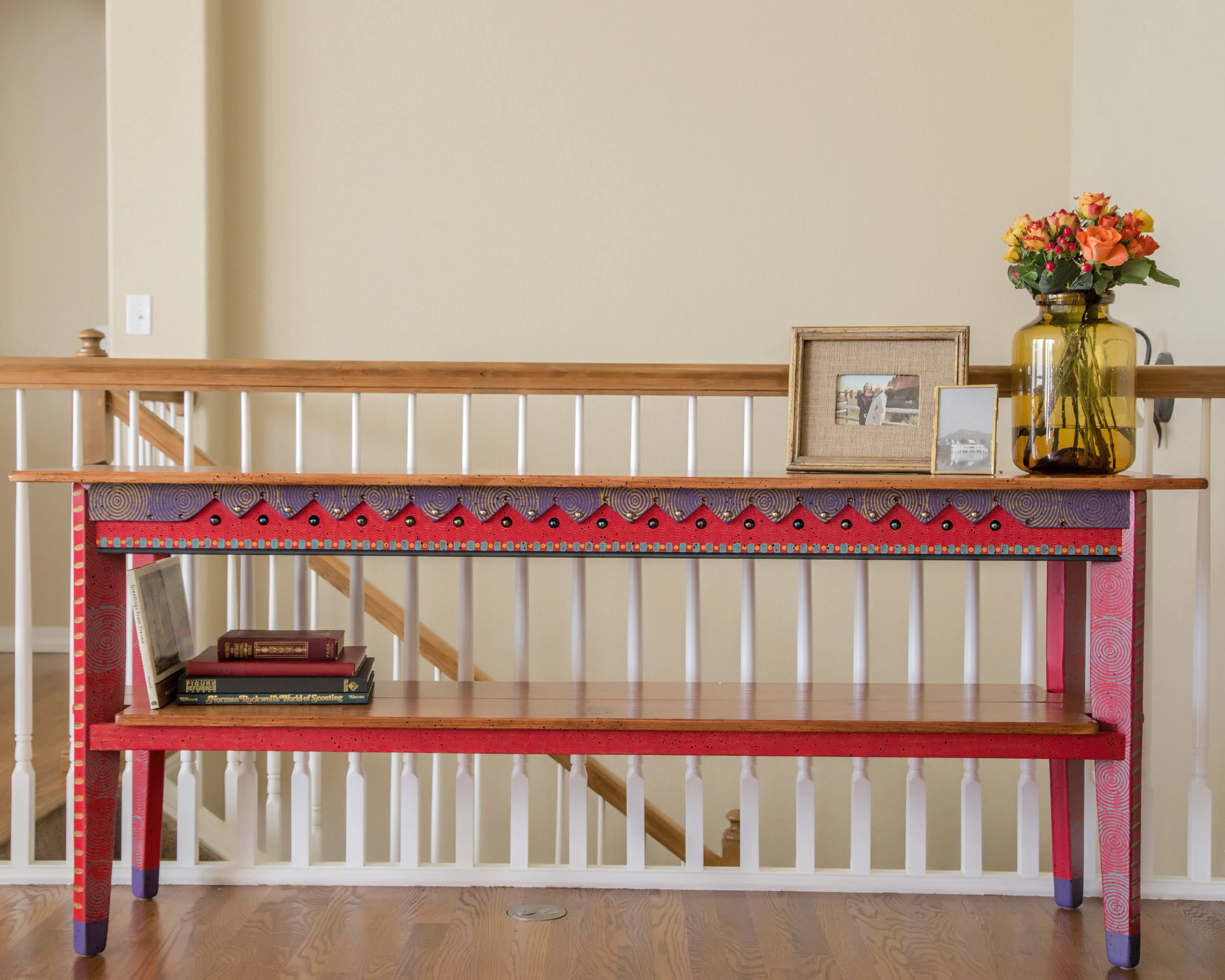 This console table matches the foyer bench. All that was needed by us was a little styling.