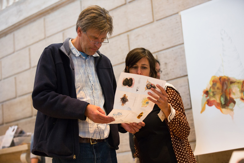   Museum visitors examine   Re:depiction  &nbsp;map to locate original artworks as described by museum staff.  