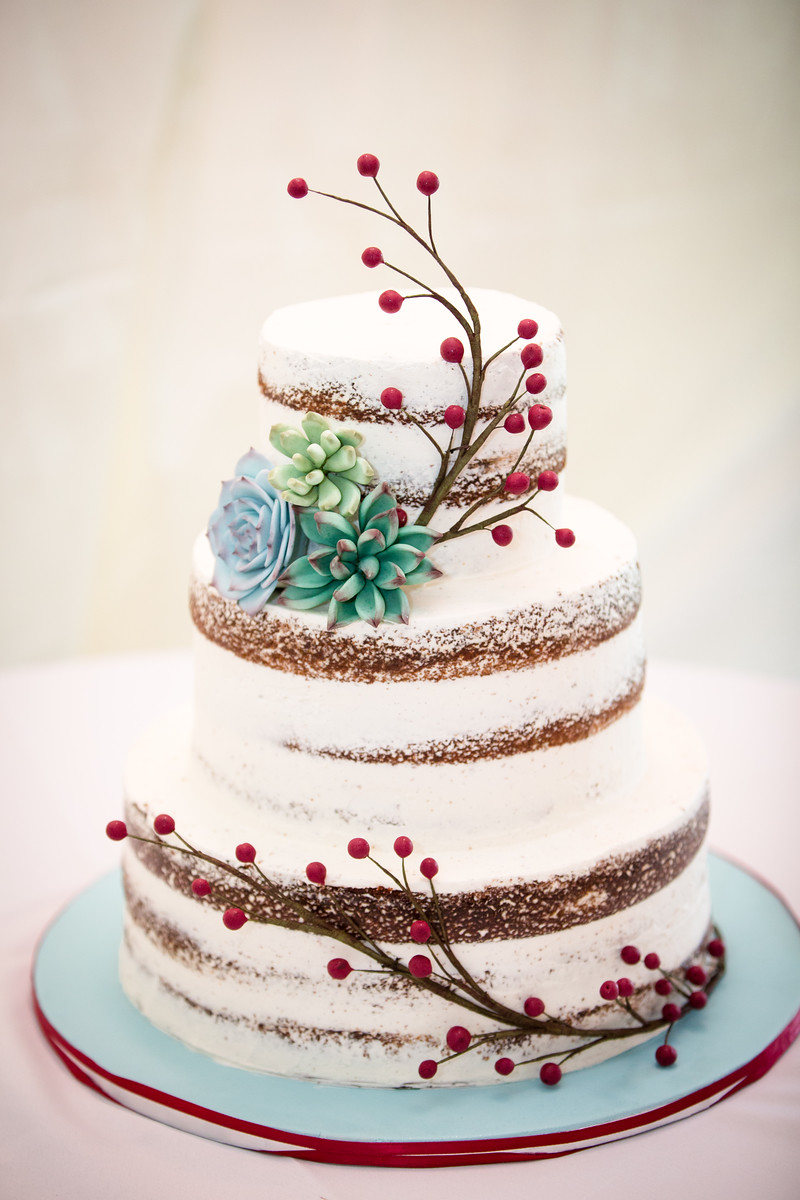 Naked cake with handmade succulents and berry branches