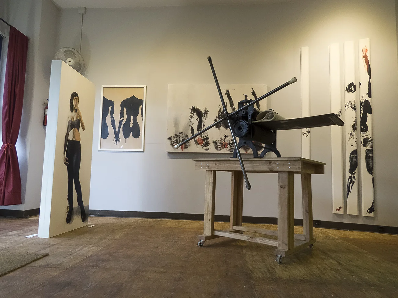 Center left: work by Phil Rabovsky. On wall: work by Lane Sell.