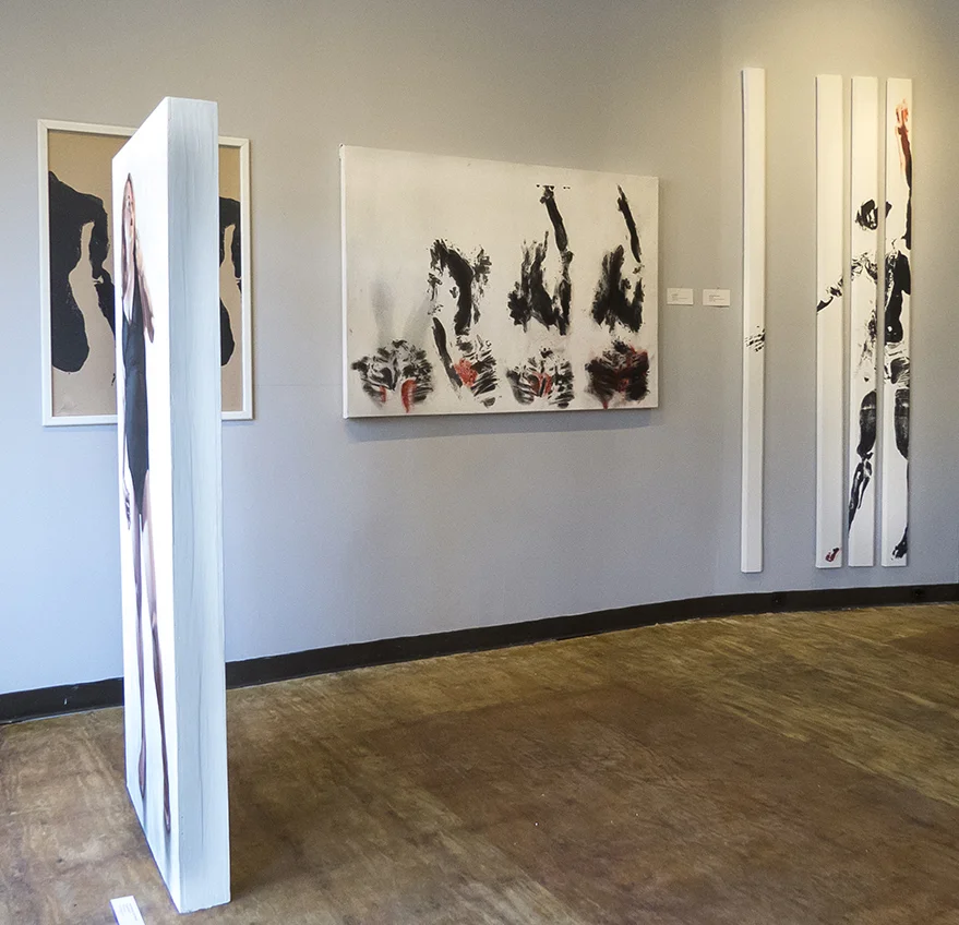 Center of room: work by Phil Rabovsky. Wall: work by Lane Sell.