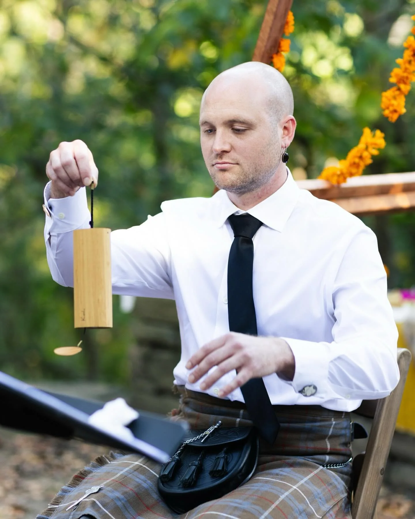 Katy &amp; Ian called in the Four Elements with chimes and readings to open their ceremony. They self-united in the Quaker tradition, invited their community to share reflections on their love, and tied the knot with a handfasting ritual and a first 