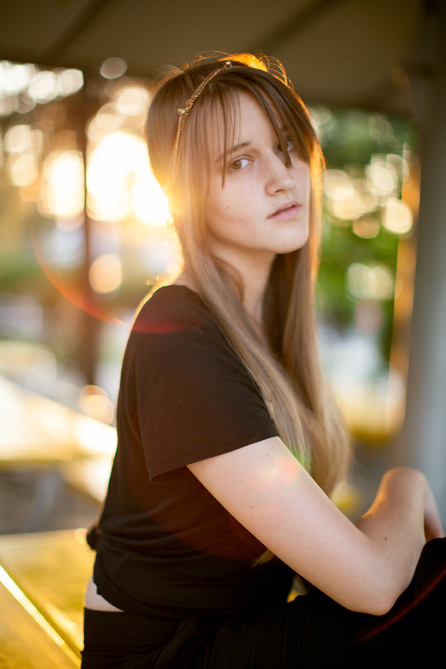 Super cool light and gorgeous model, but Annette is just sitting on a plastic picnic table in Denver.