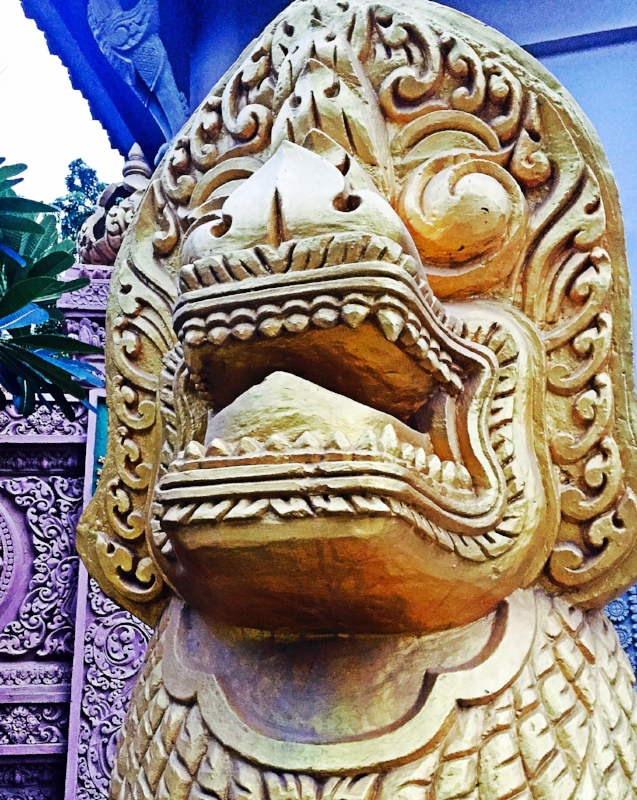 Standing guard outside a Wat
