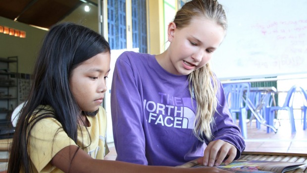 Nadia Winthrop, 11, volunteers teaching English once a week to kids living in a Phnom Penh slum