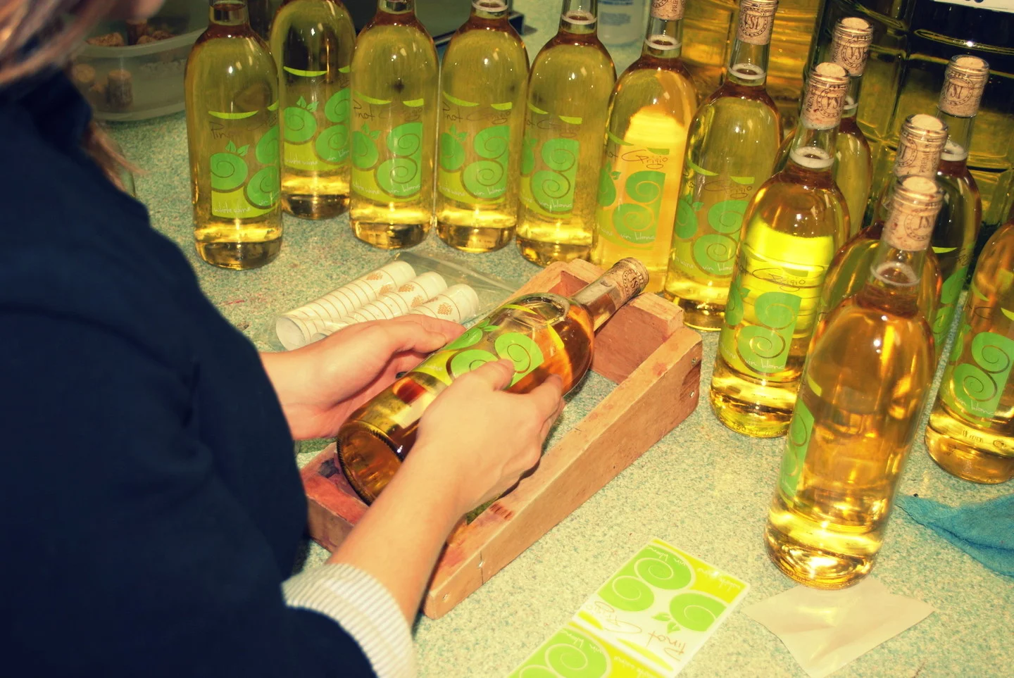 Labeling bottles by hand