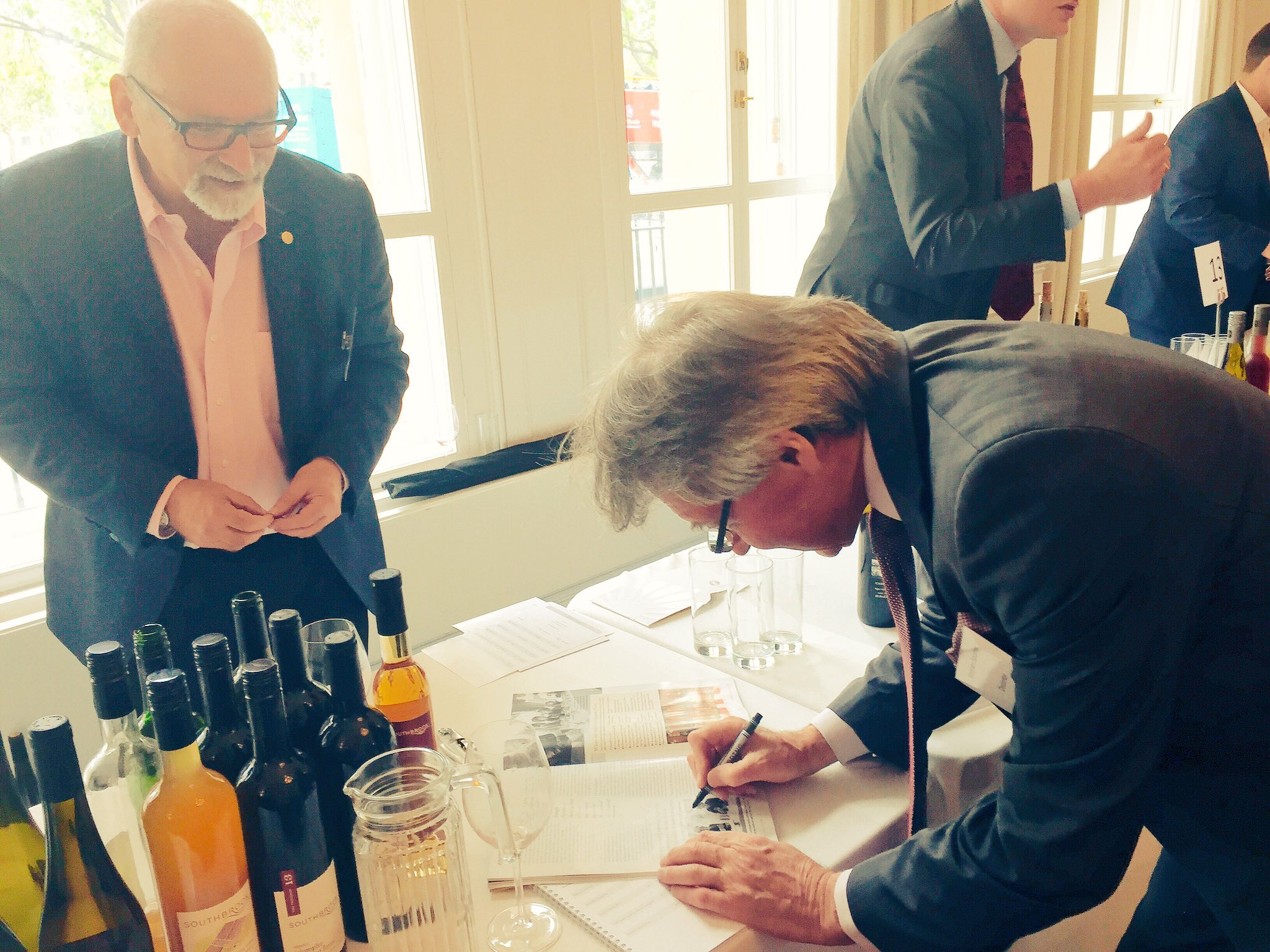 Stephen Spurrier signing an autograph for Bill Redelmeir, founder of Southbrook winery in Ontario, Canada