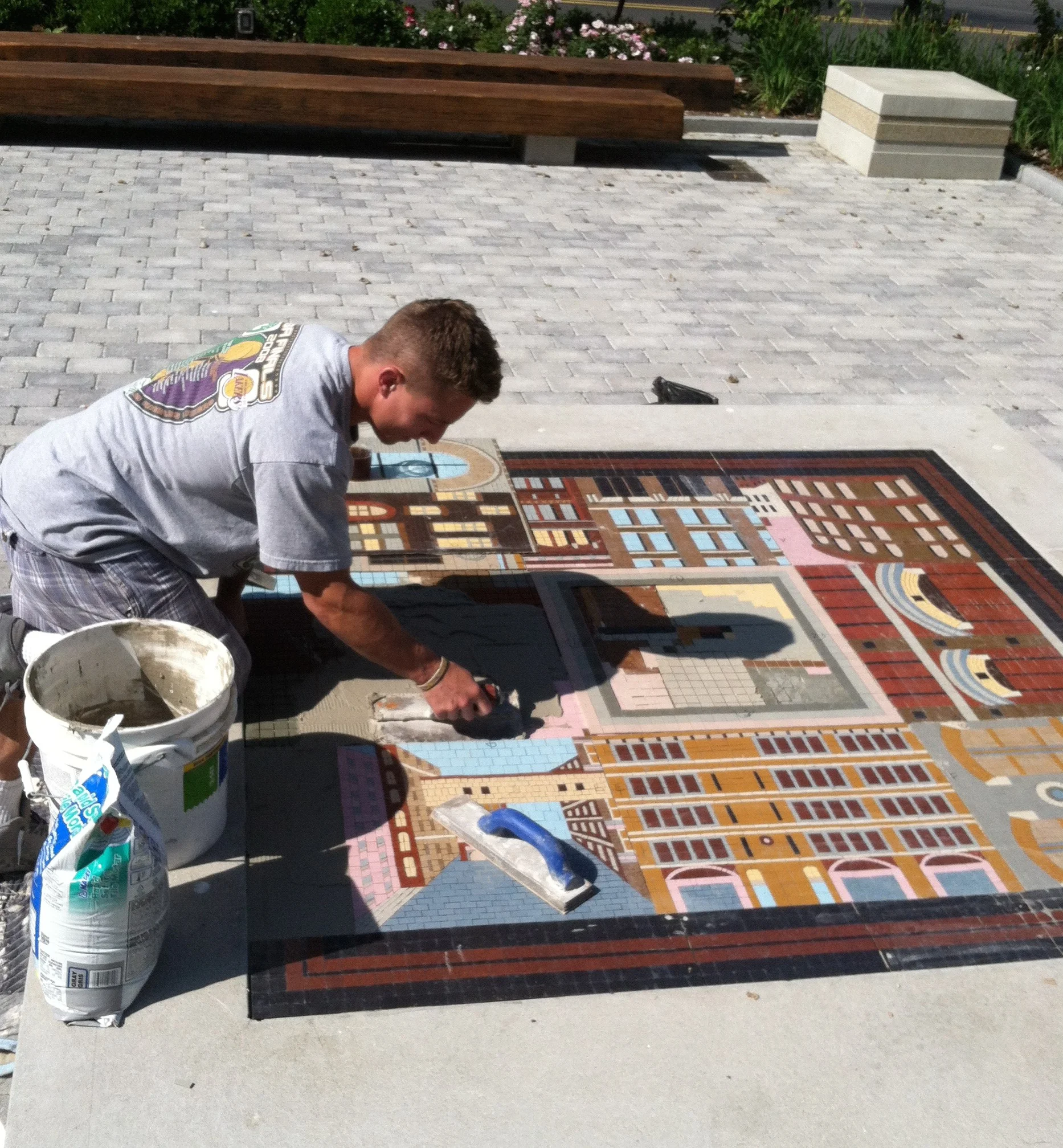 Dan Sacco installing the mosaic in Iron Street Park, Boston