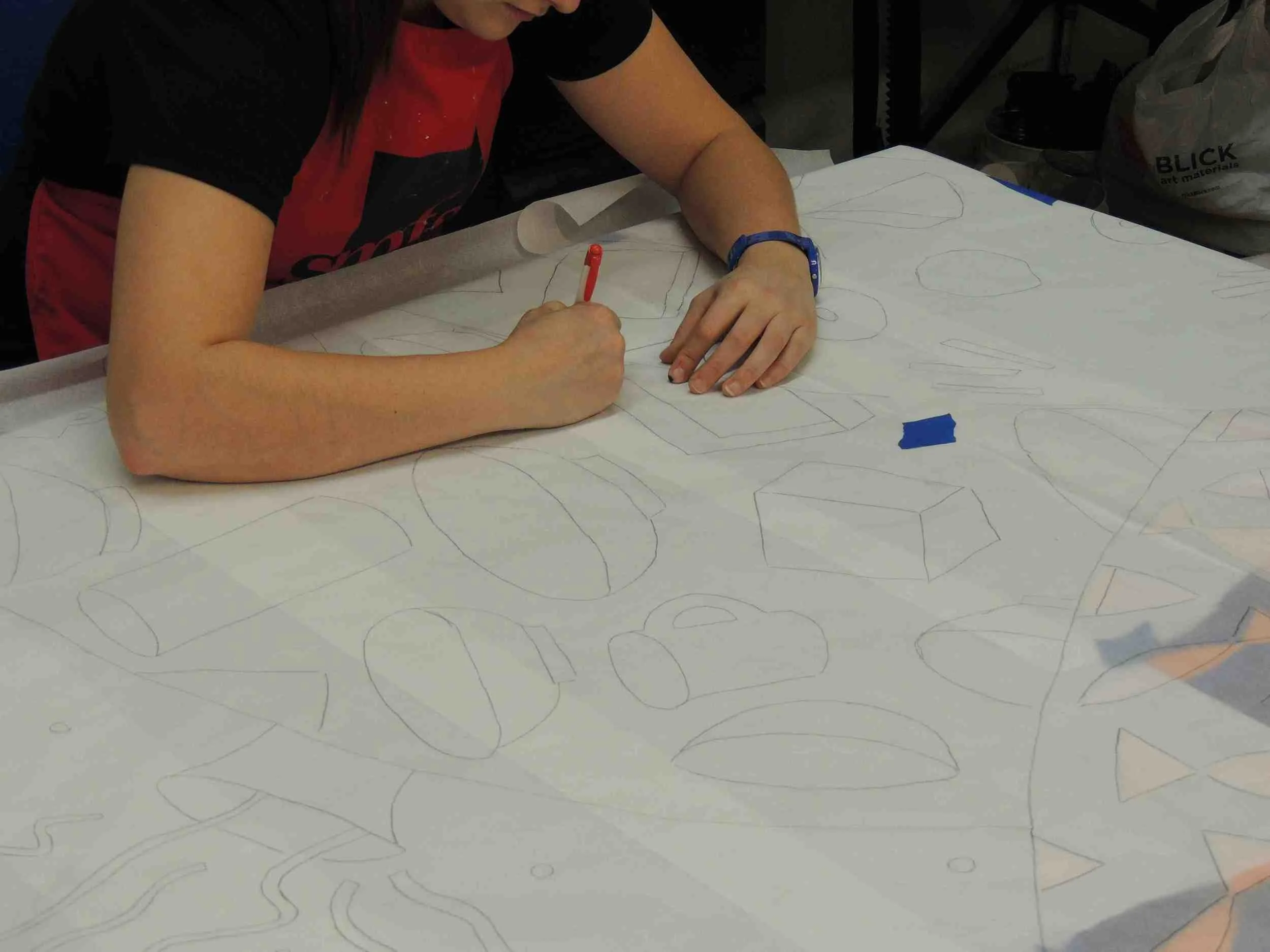 Rachel Newsam transfers the designs from the original mural onto the newly refreshed panels.
