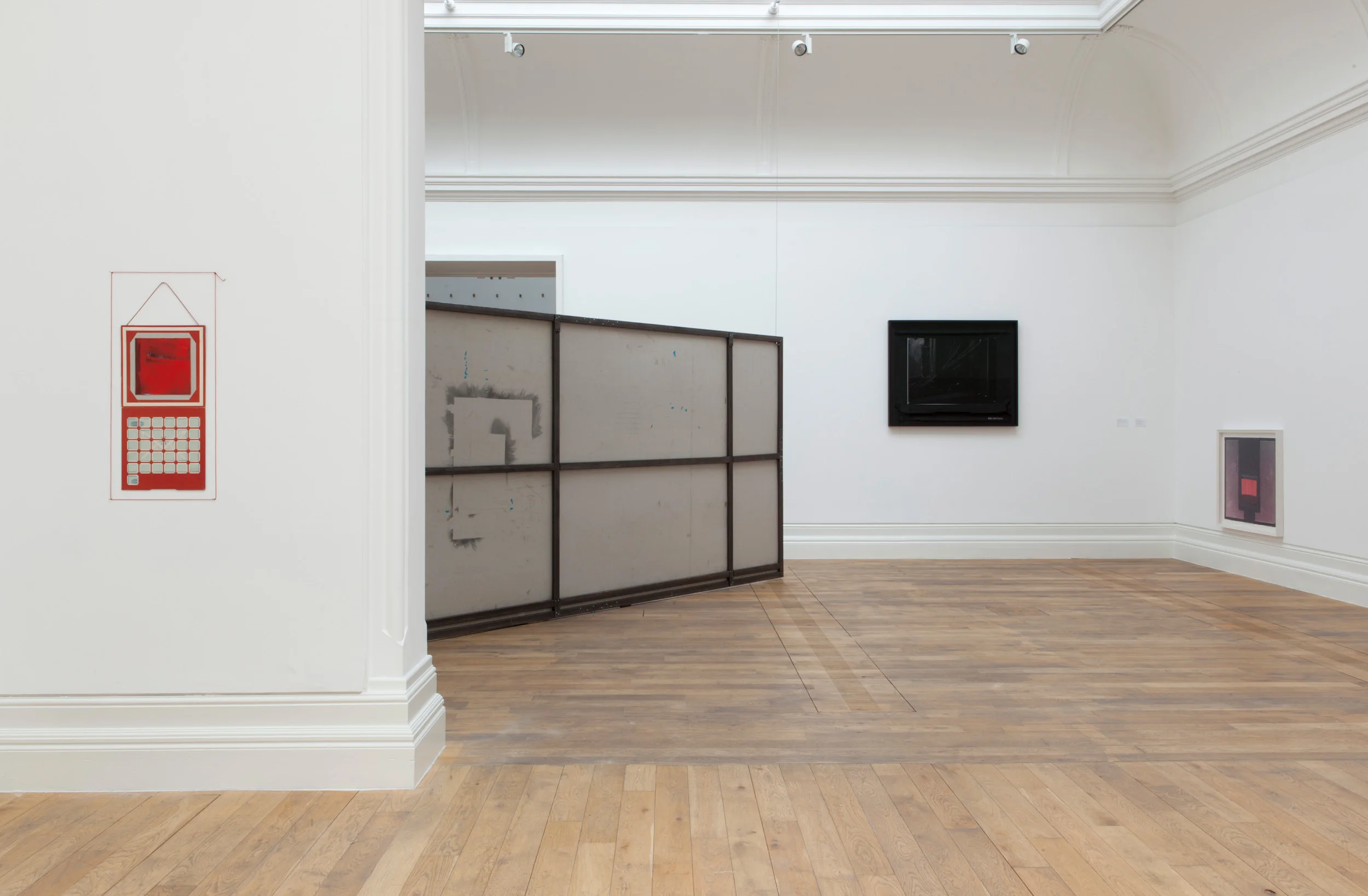 Segue , installation view. Left: May (Calendar) , 2013 Airmail envelope, LP cover, string, pins, household gloss paint 85 × 40 cm Centre: October , 2015 Paper, graphite, greyboard and steel 535 x 260 cm Photo credit: Dewi Lloyd.