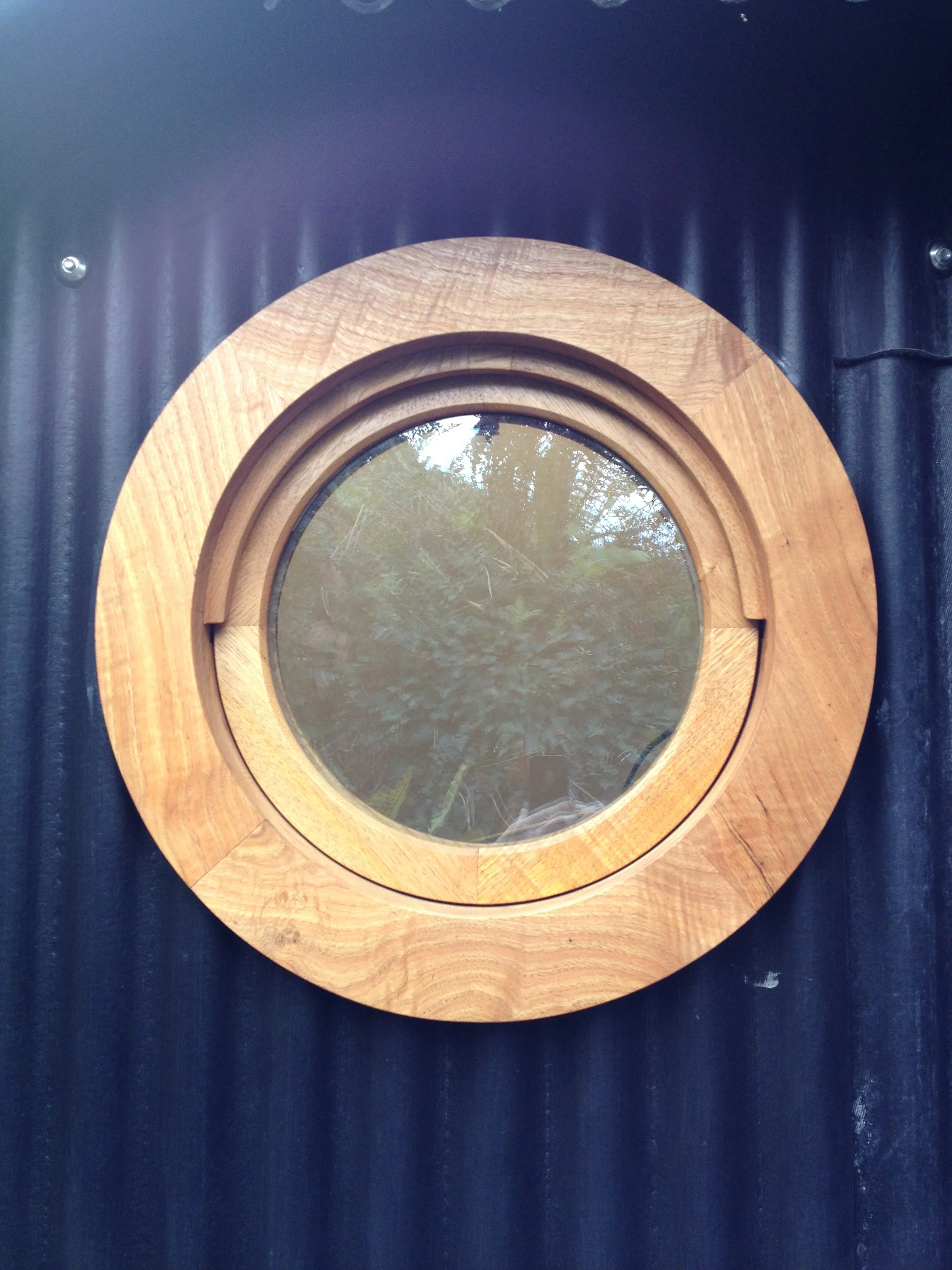 porthole window of boatshed