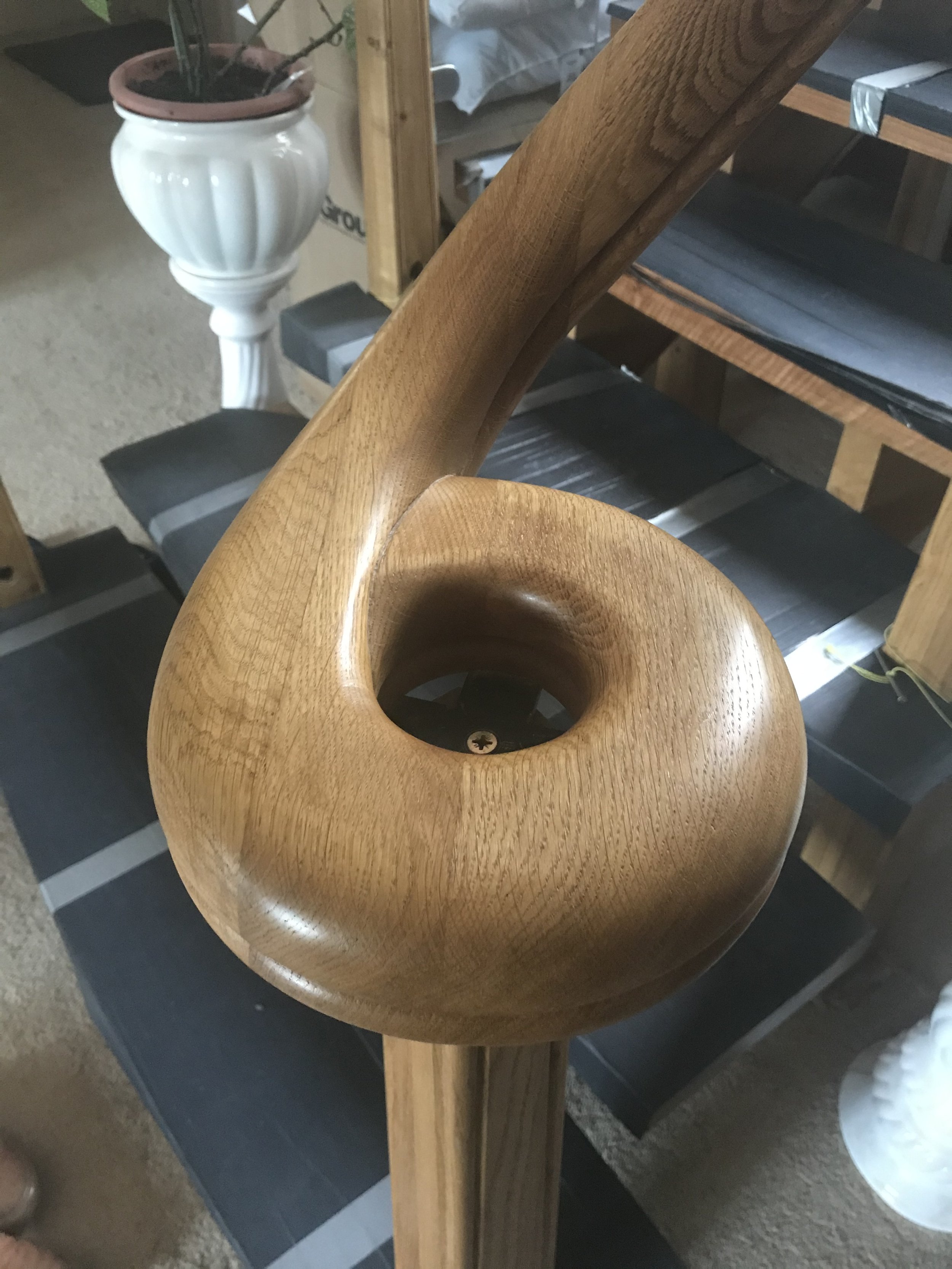 Oiled and waxed Oak scroll on banister 