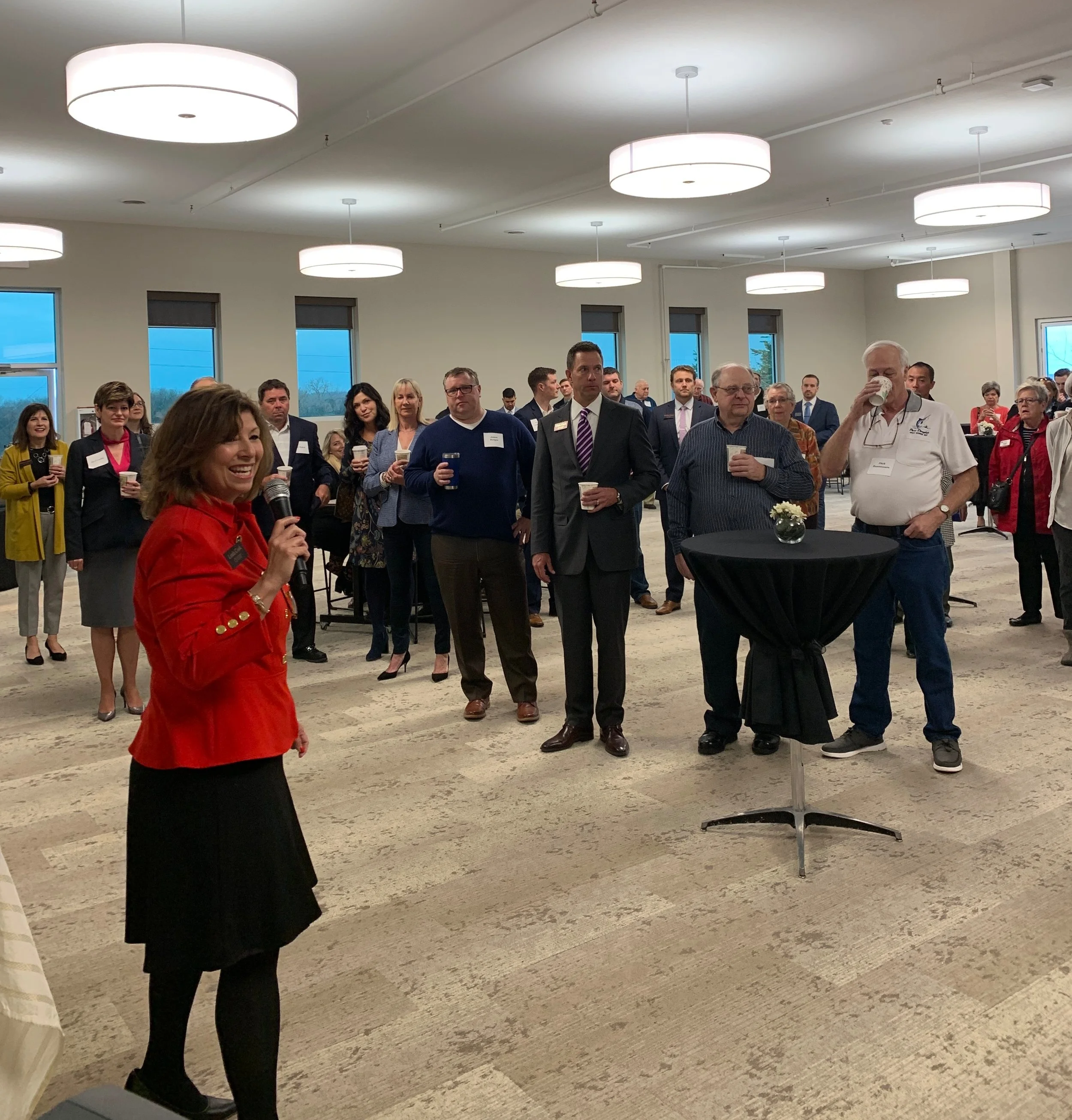 Linda Cook, President, Welcoming Guests at the Gilbert & Cook Ribbon Cutting Breakfast