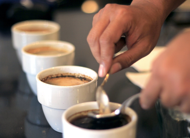 Mirza Luqman Effendy of Brewphobia in South Jakarta prepares coffee for a cupping session. -- Yosef Riadi for NPR