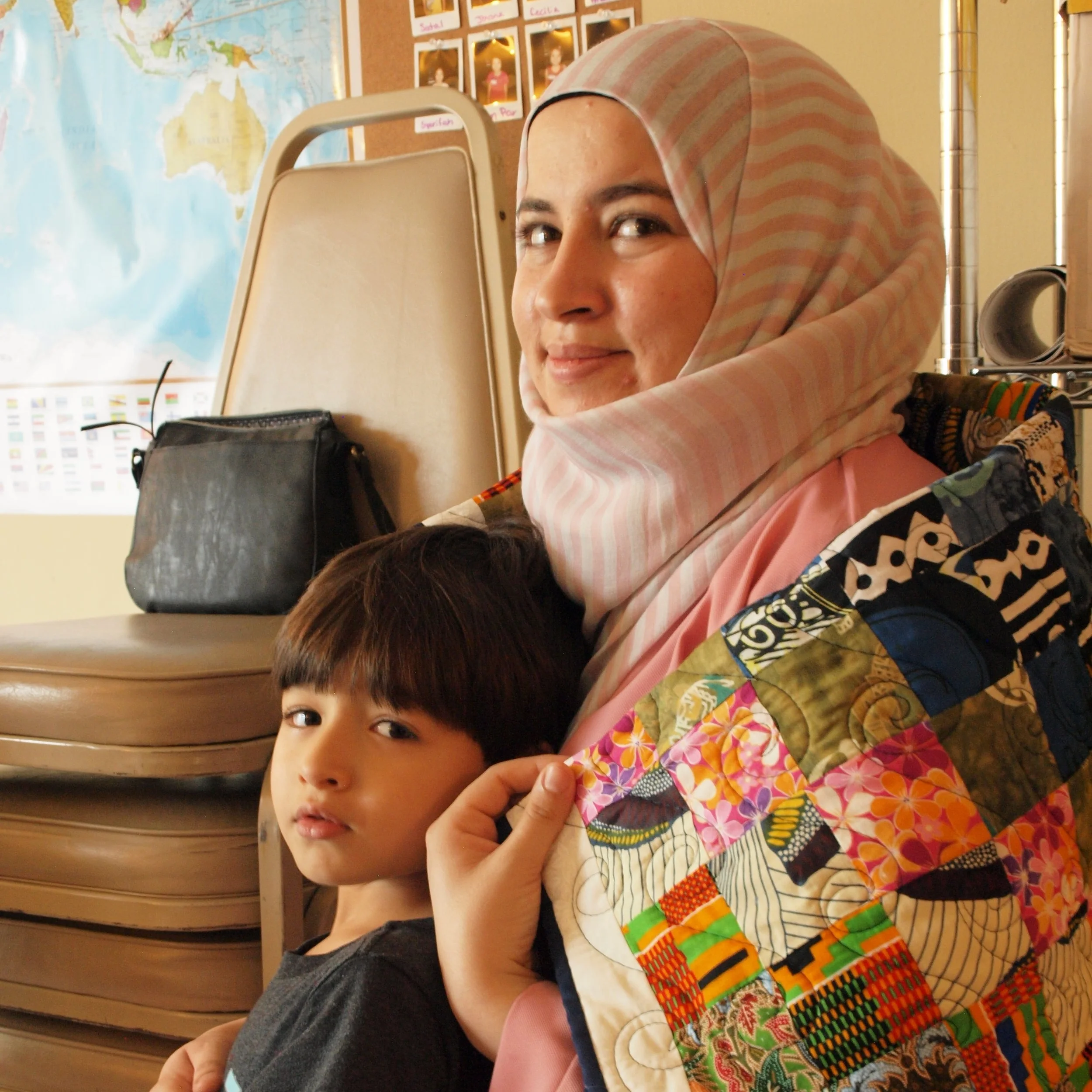 Muna and Her Son with the Quilt Made by Kay