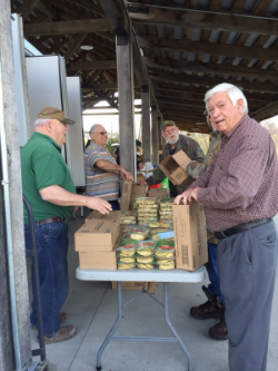 Bobby, Duane and Jimmy sorting and packing