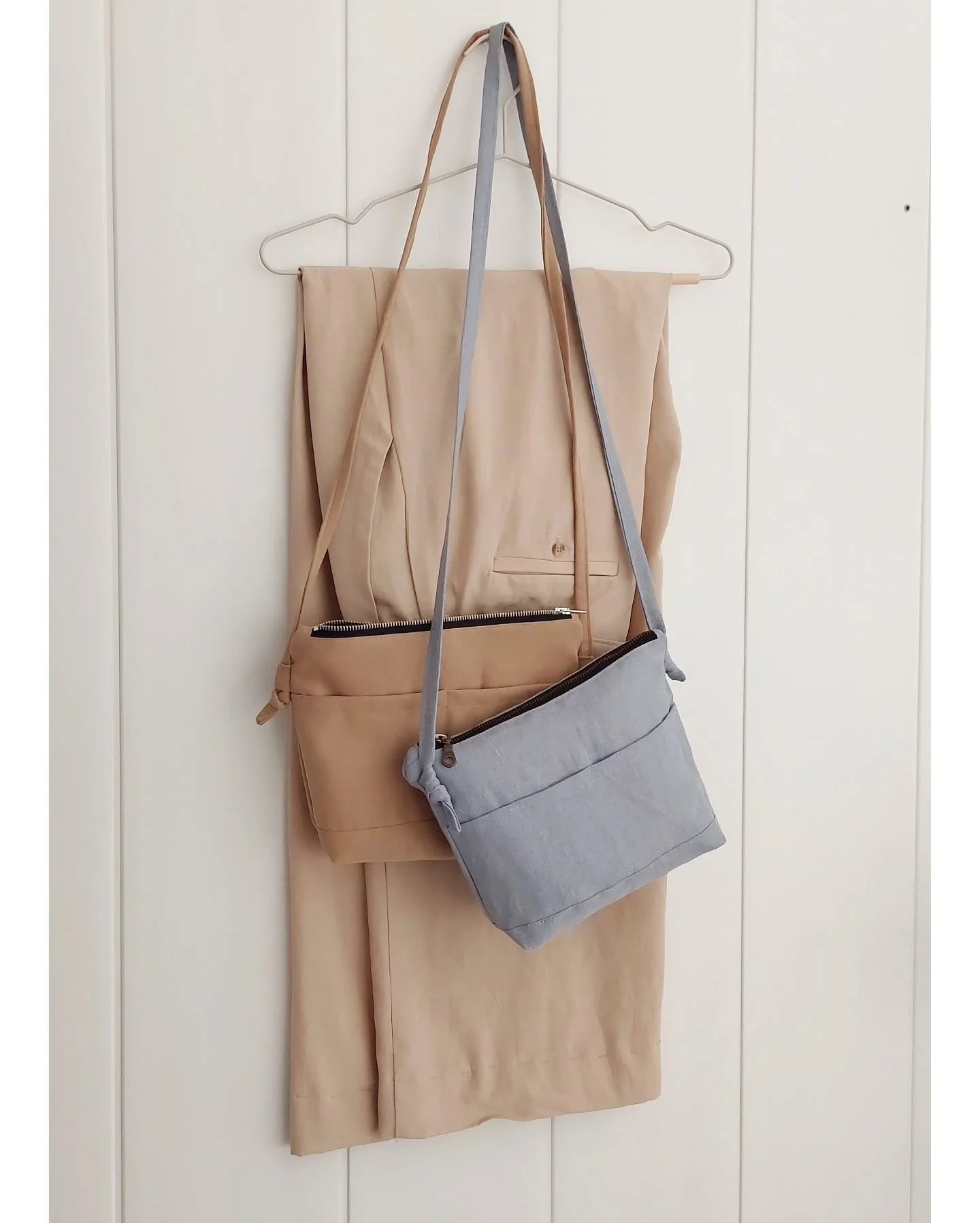 Some cute little bags (+ a pair of Tencel linen pants ready for hemming).

I made these for class samples. It's basically a zipper pouch with extra pockets and a strap (there's a tutorial on my blog about how to make one). 
The beige one is made with