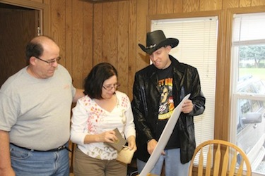 Kevin McGee helping his customer's pick colors for their new home.