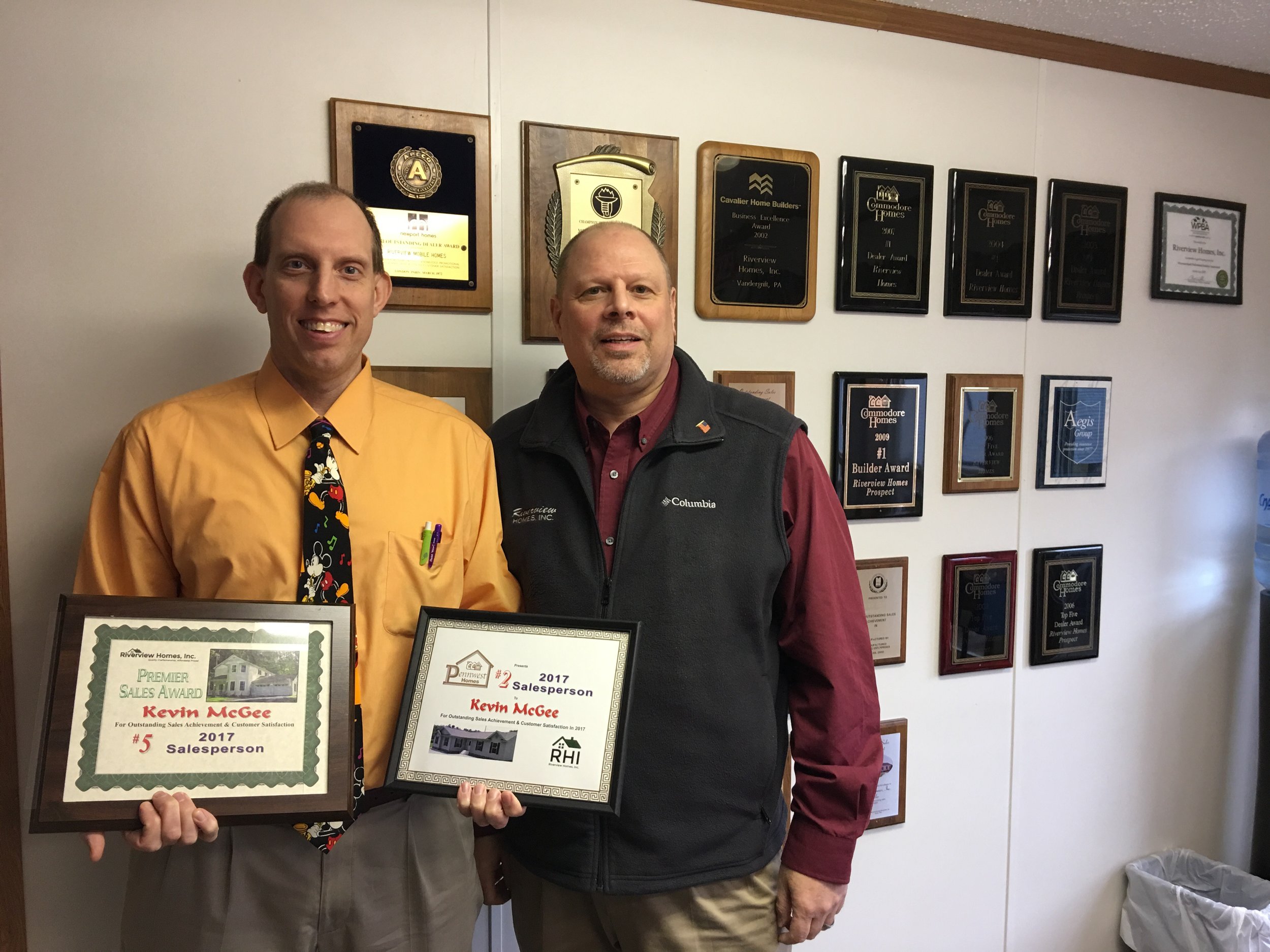 Kevin McGee receiving his awards.