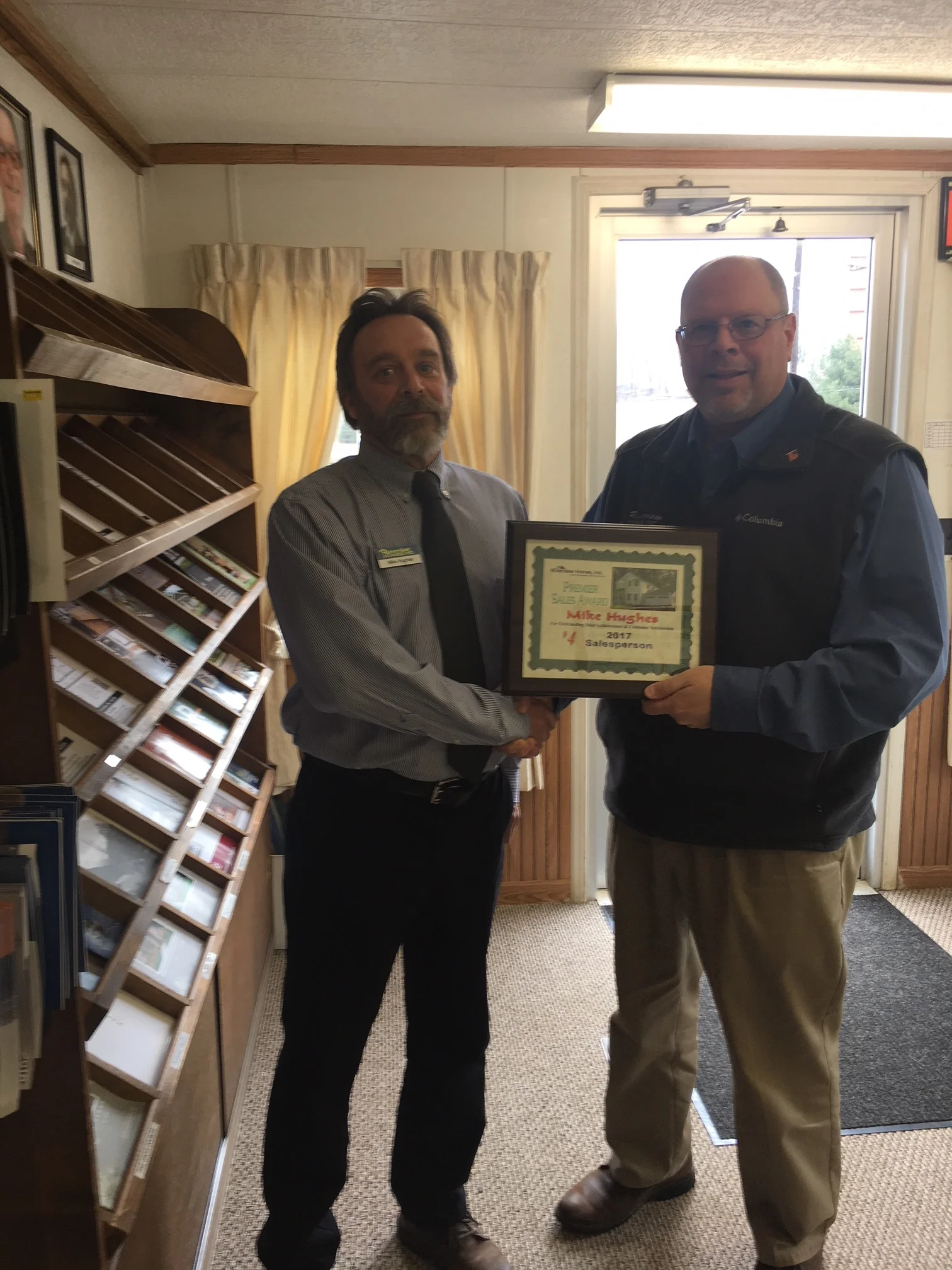 Mike Hughes receiving his awards.