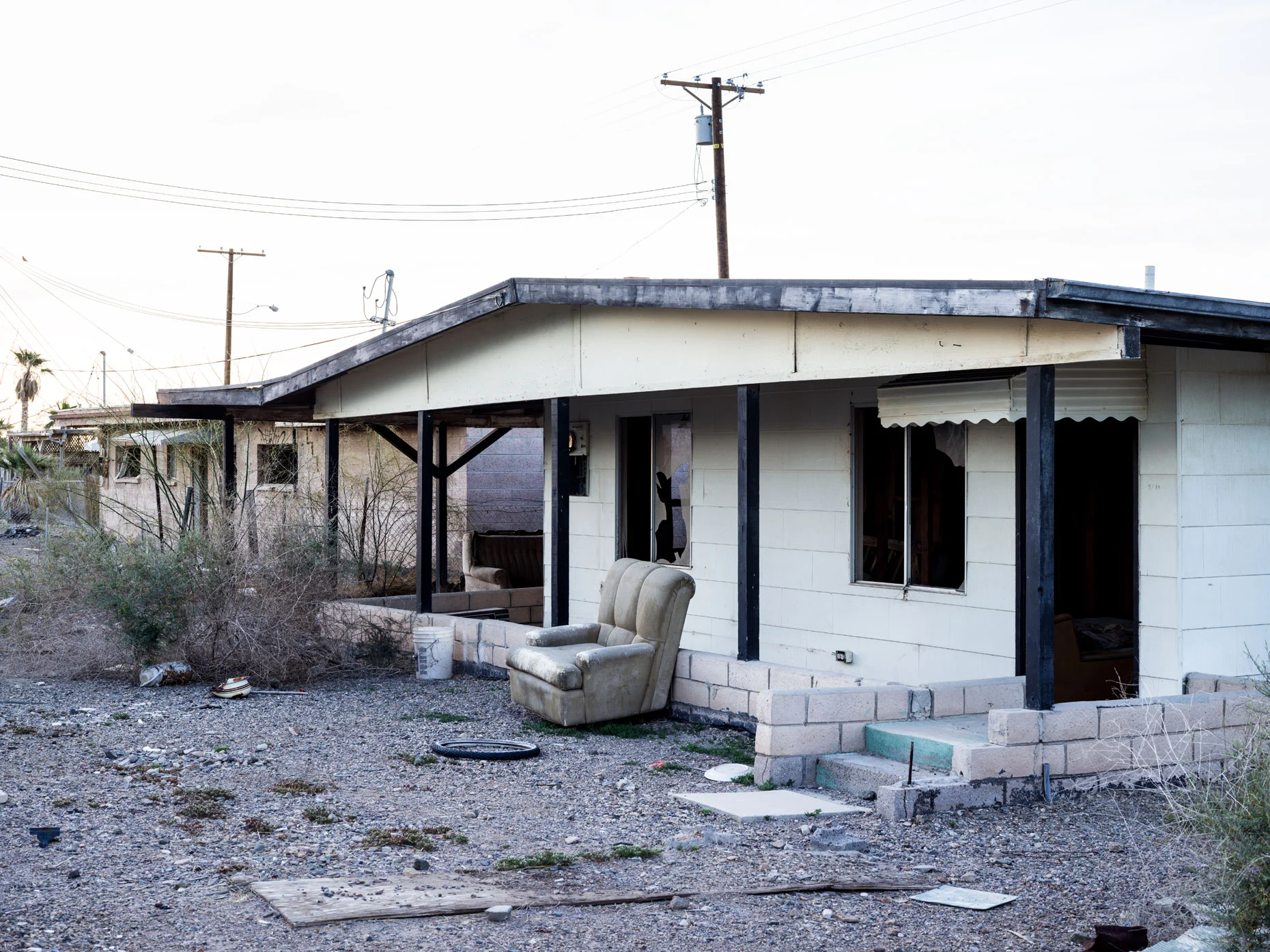 Bombay Beach decaying house with couch in yard