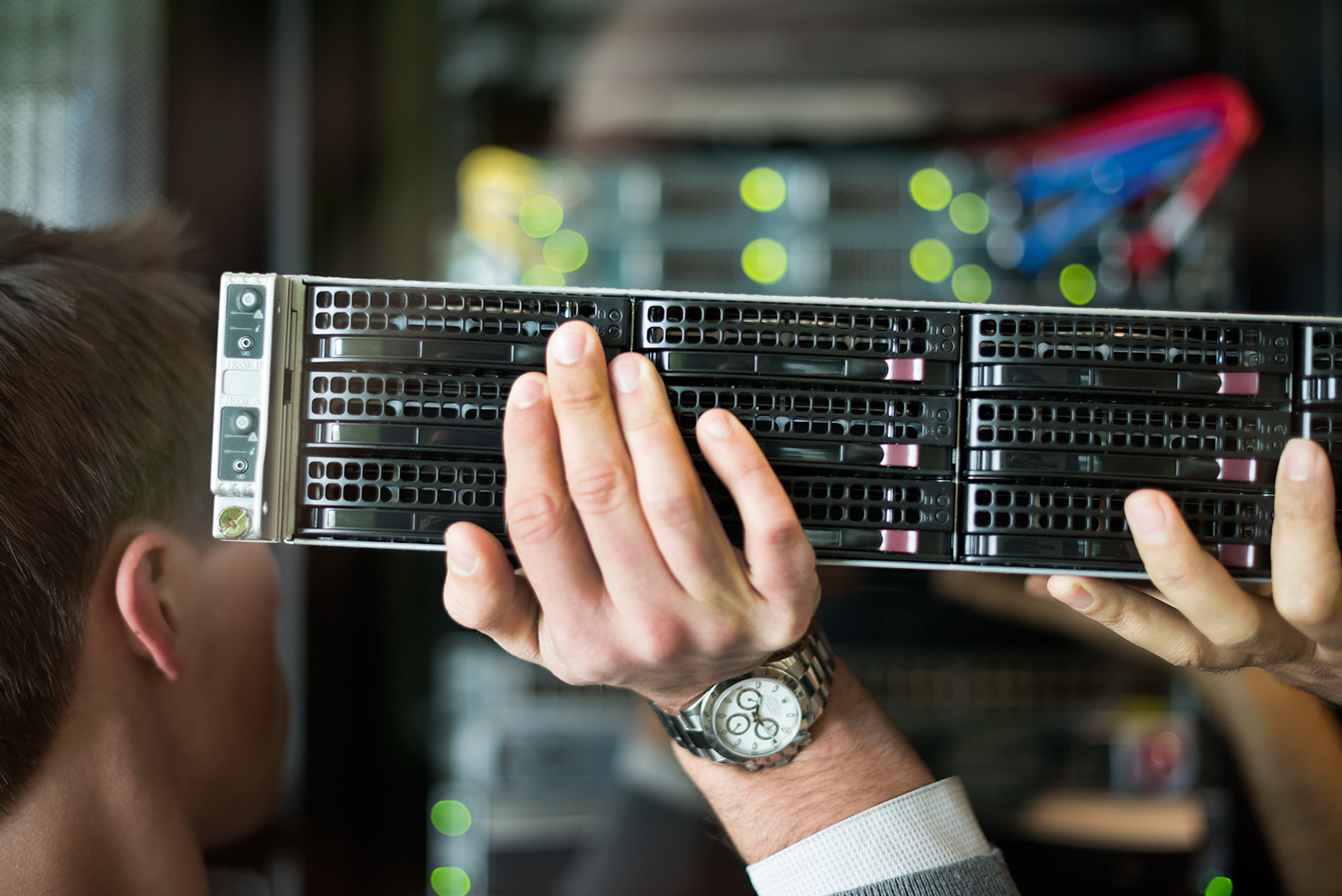 men carrying products in a data center