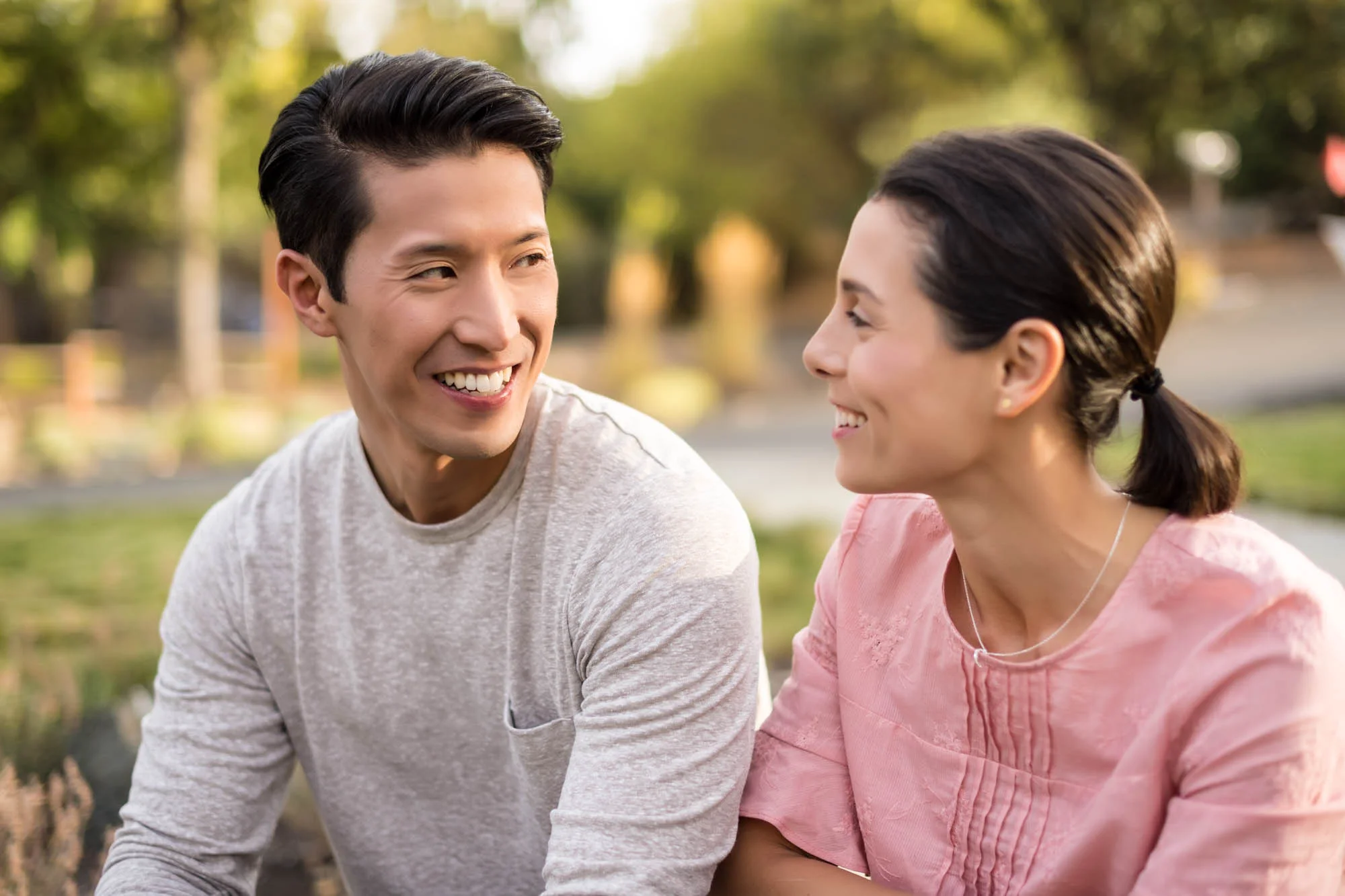young couple smiling and looking at each other