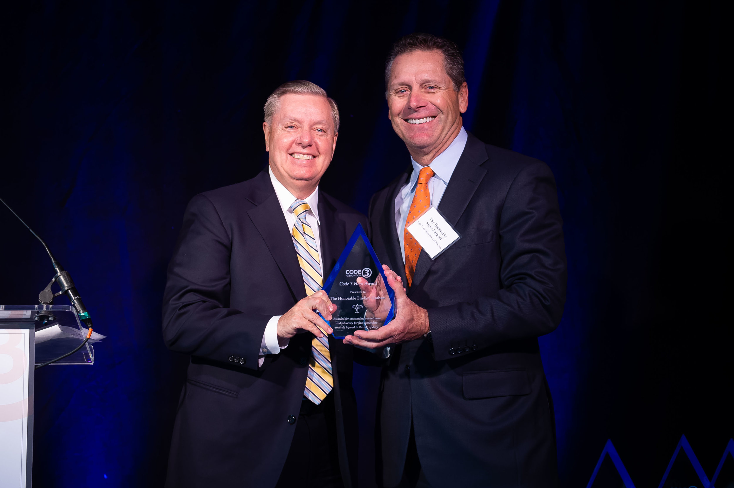 The Honorable Steve Largent of the Code 3 Board of Directors, presents Sen. Lindsey Graham with the Code 3 Heroes Award, Sen. Graham is one of four recipients of this honor this year.