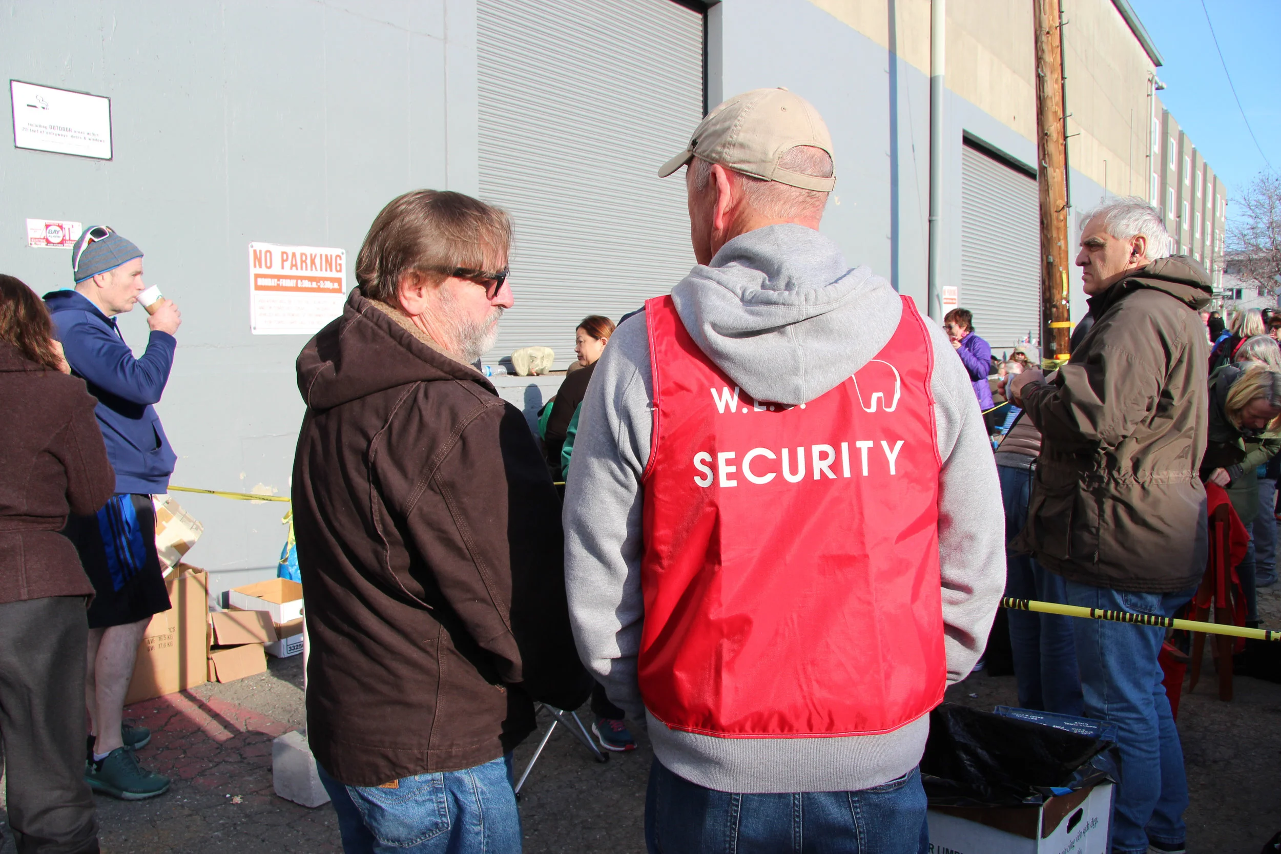 The White Elephant Sale has security to check wristbands and manage the flow of people.