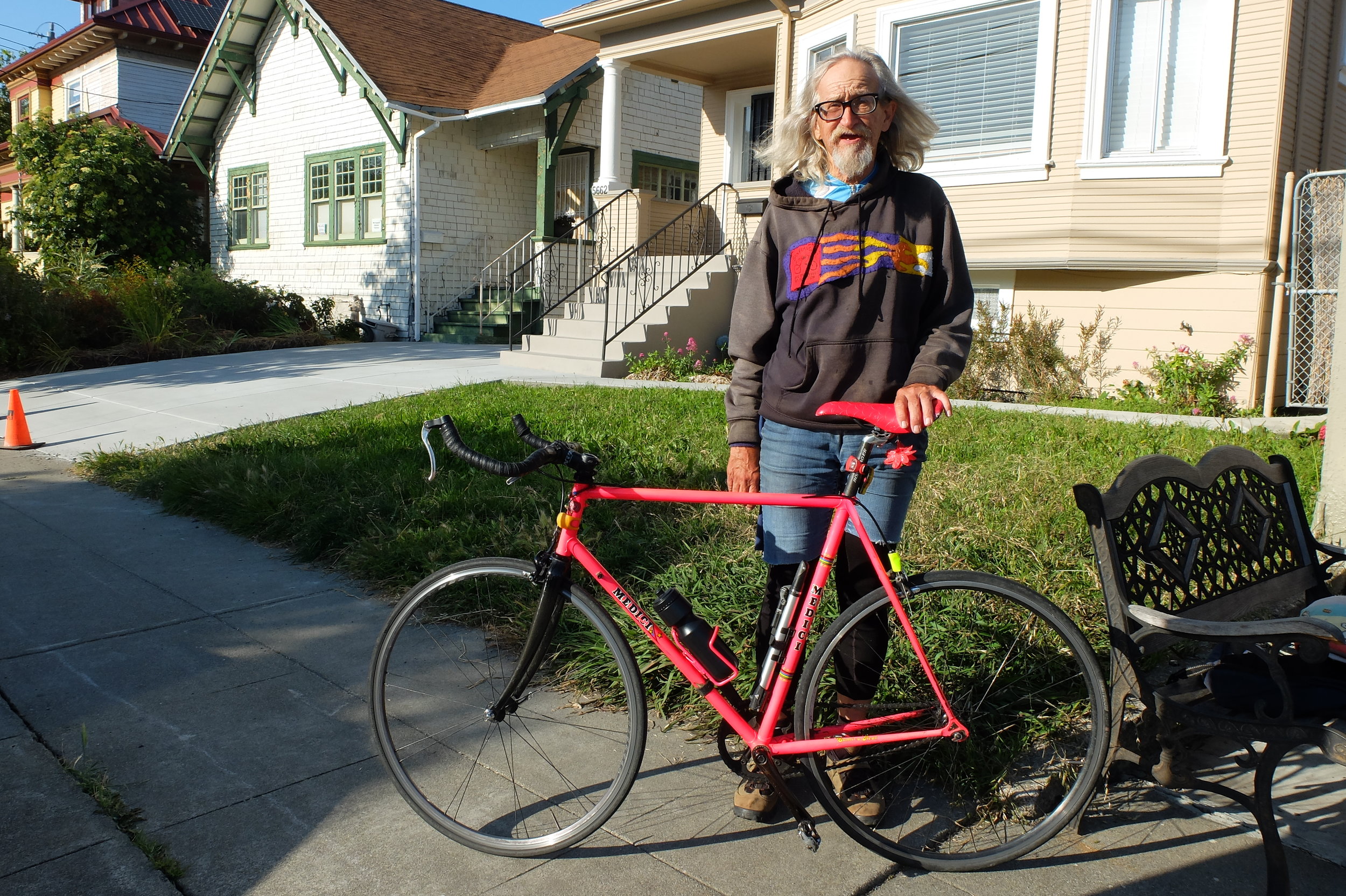  Roger, a retired bike messenger, stands with his pink Medici fixed gear bicycle. 