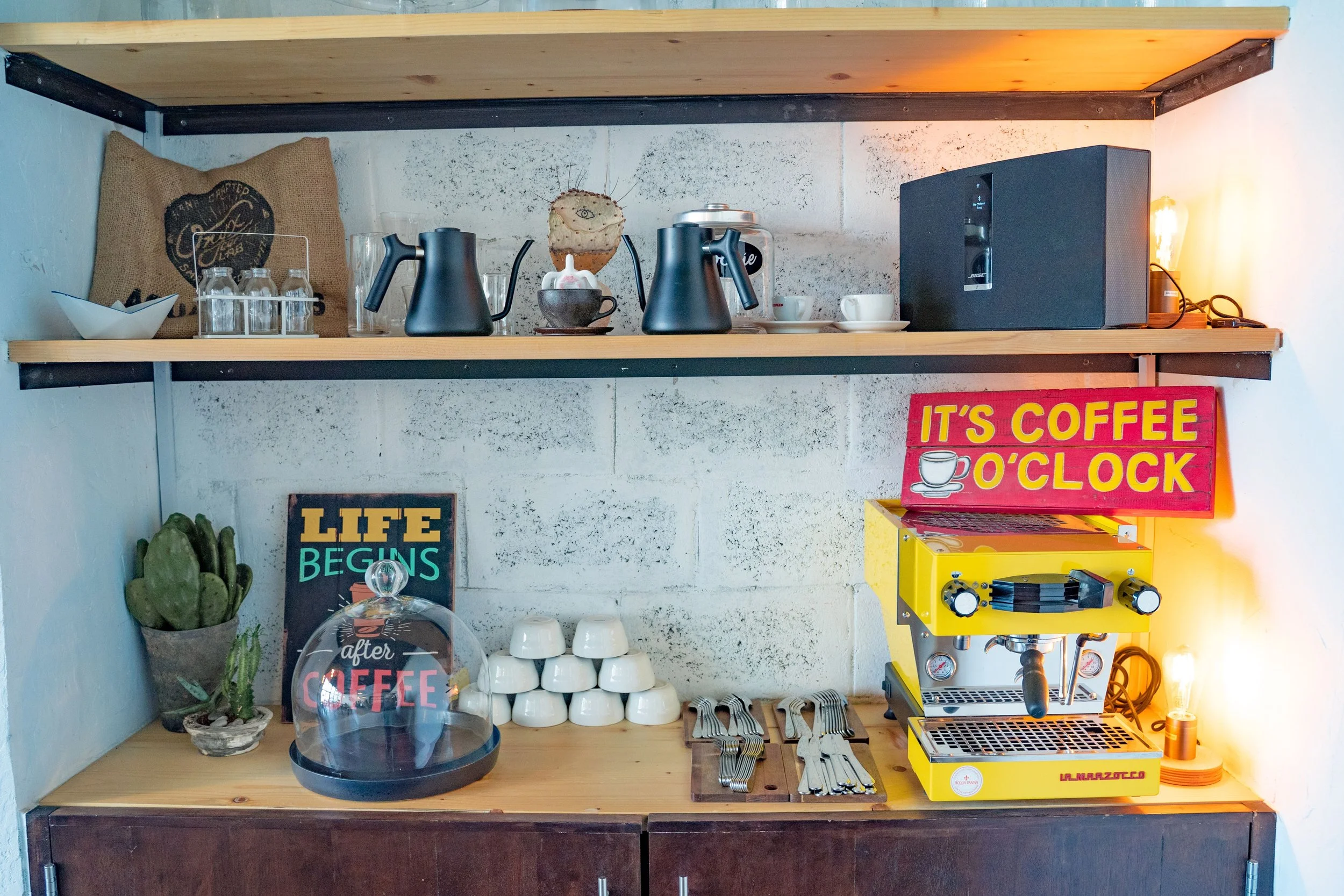 Organized home coffee station tucked neatly inside a dedicated cabinet.