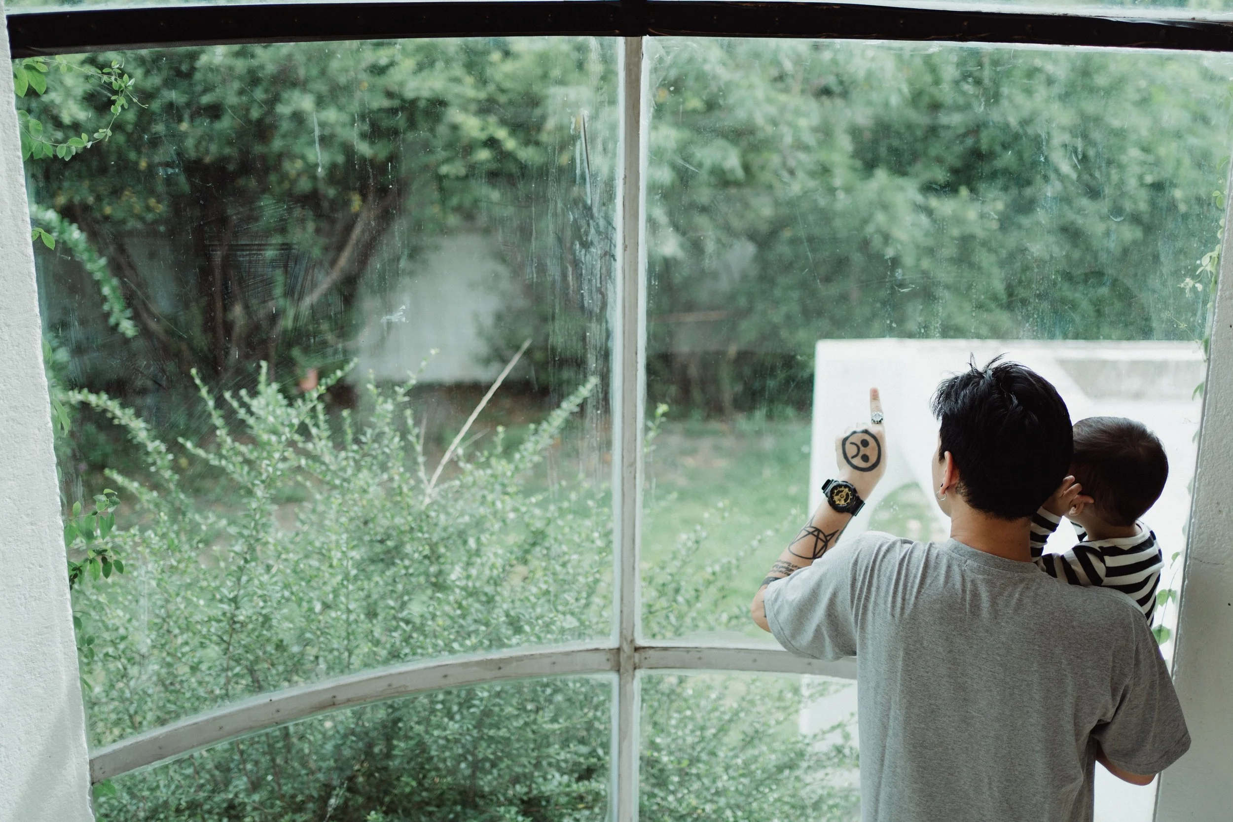 Homeowners watching a thunderstorm approach from inside their living room.