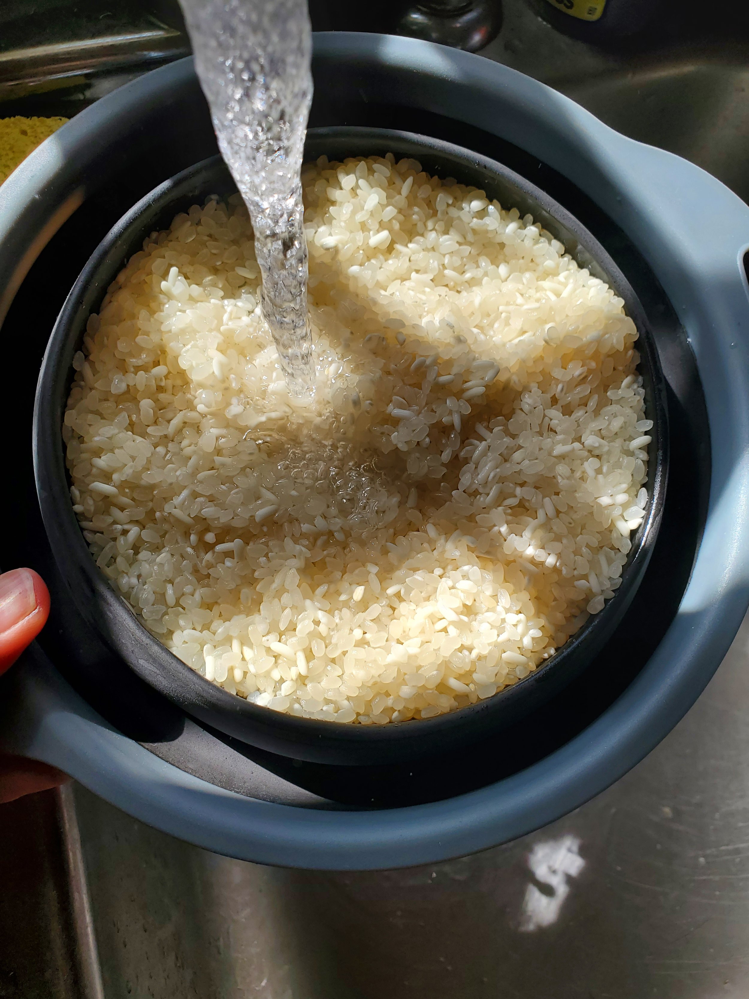 You need to rinse your rice before you cook it, to make it fluffy and sticky