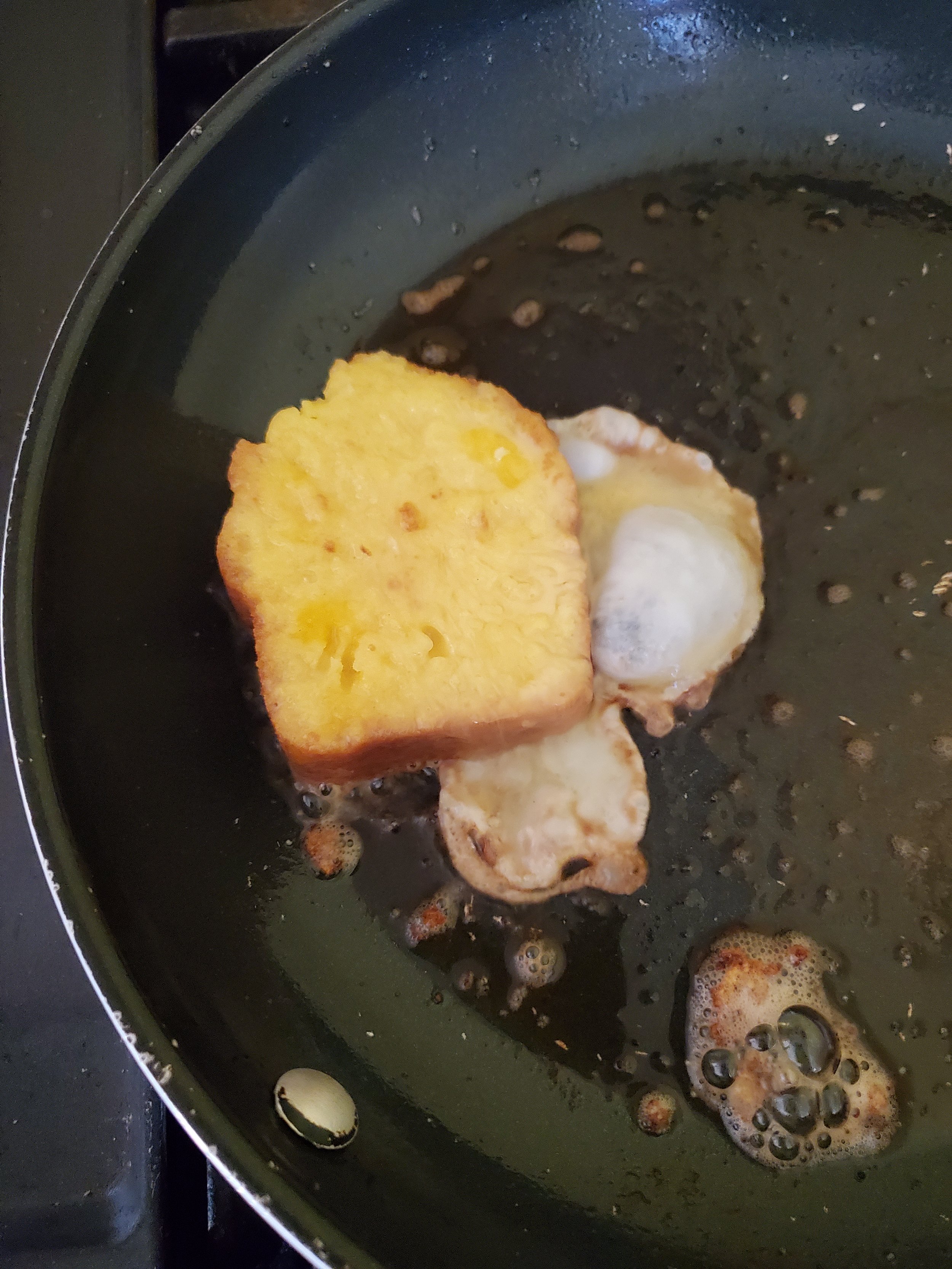 First piece of lemon french toast goes into the pan~ 