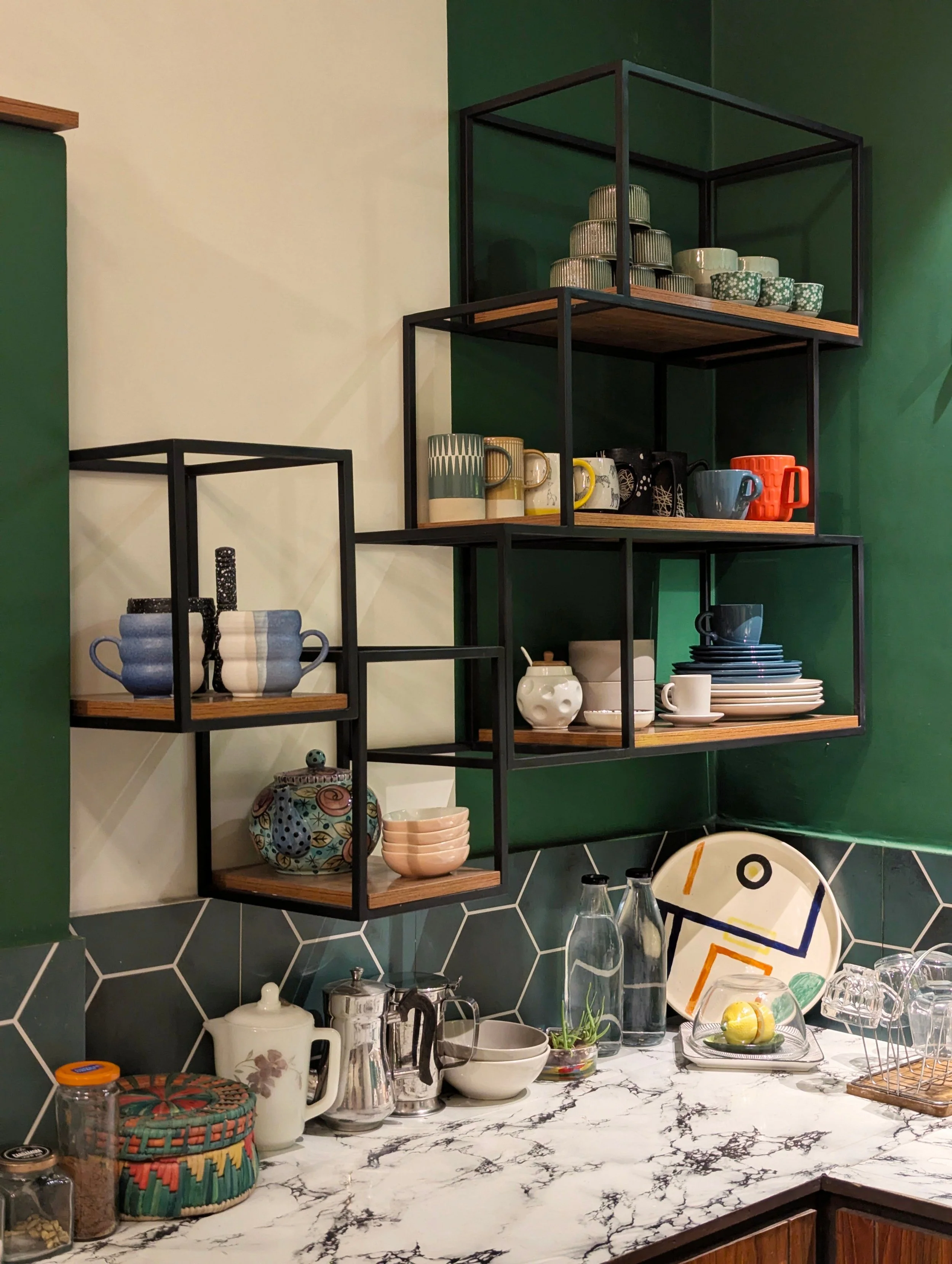 Kitchen with open shelving beside modern cabinetry illustrating changing storage trends.