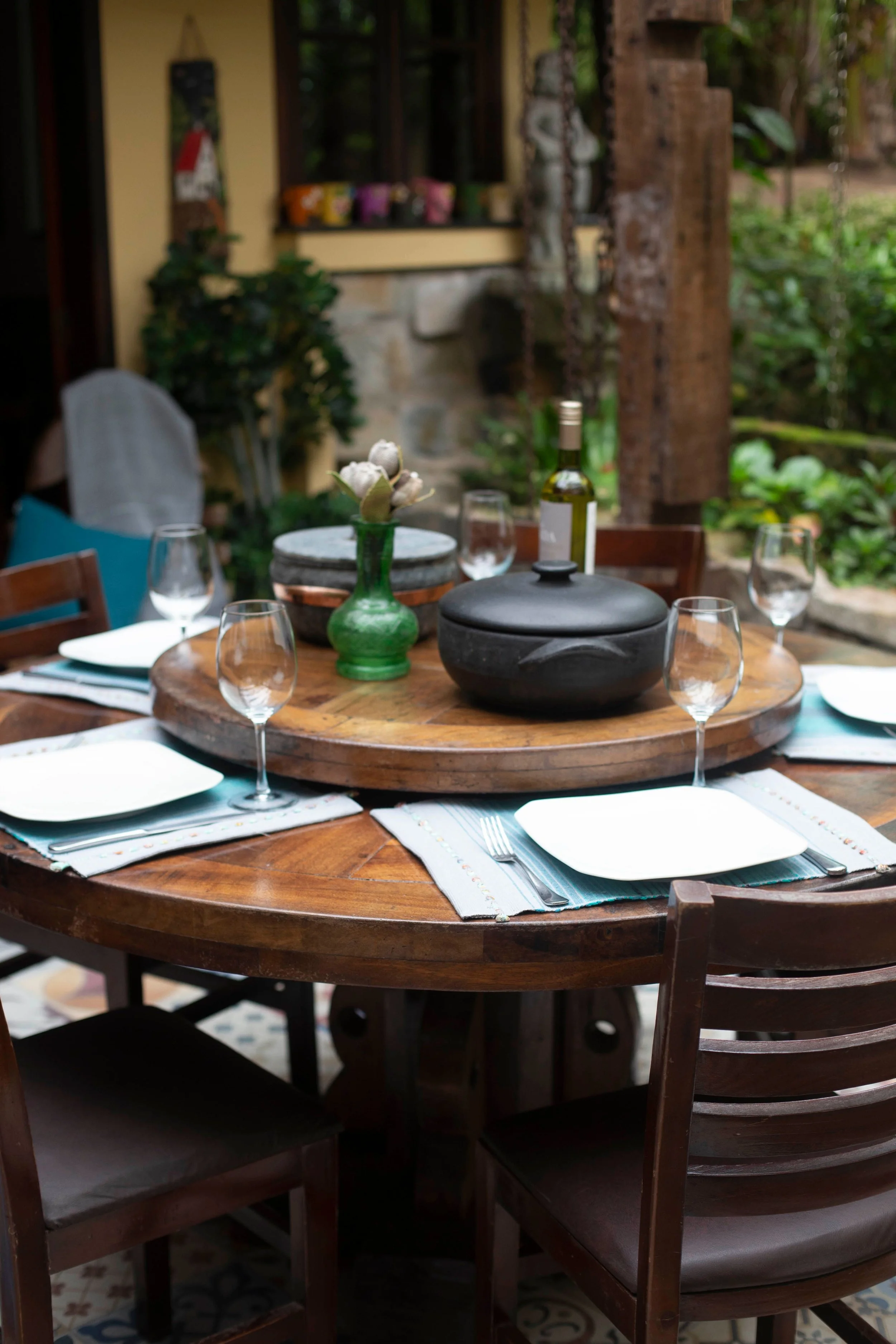 Outdoor dining area designed for entertaining guests near a backyard kitchen