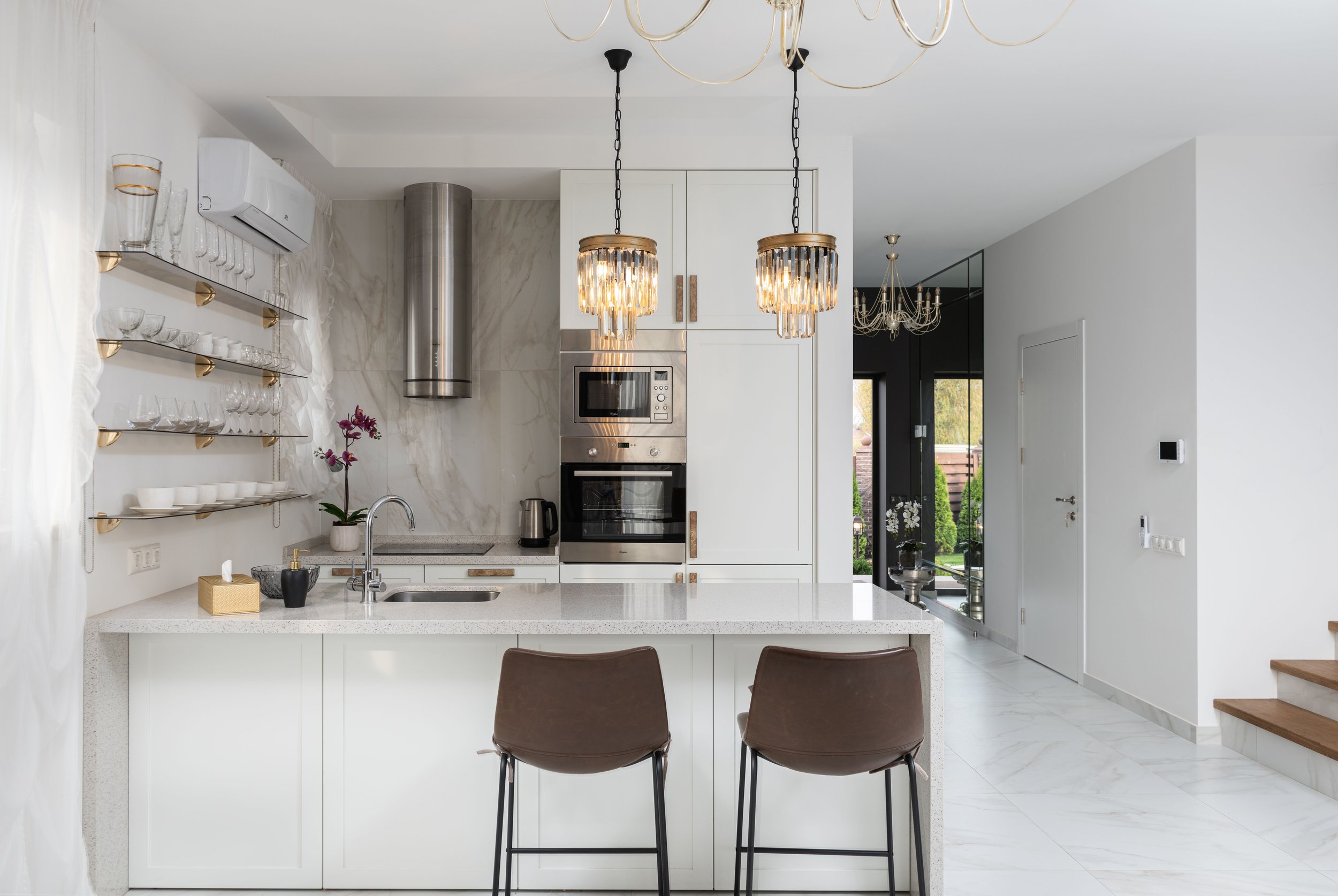 Sunlit family kitchen during summer with household appliances working to keep the home comfortable.
