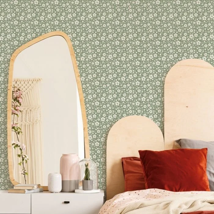  Image from Tempaper  A small pattern of flowers on a green background, fades into the background allowing the curves of the room to be more prominent 