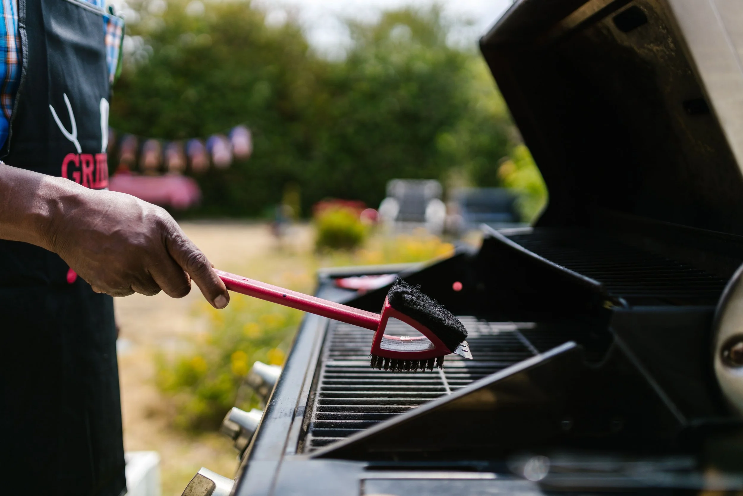Cleaning grease and residue from a backyard grill