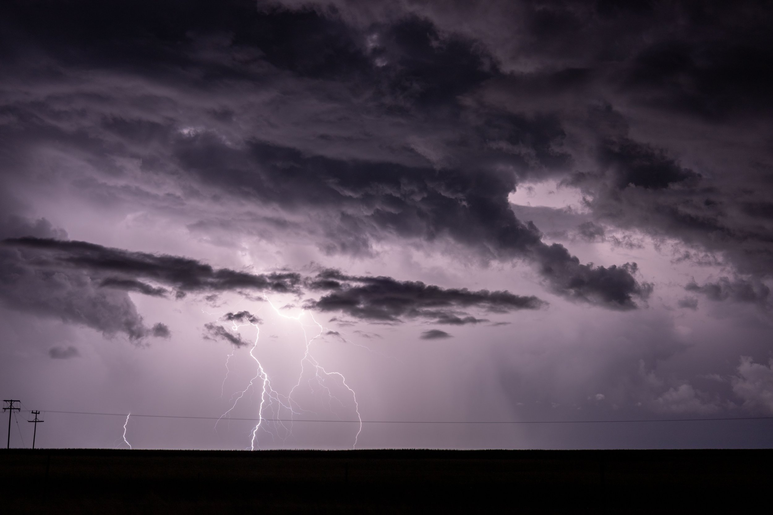Lightning illuminating the sky during a powerful summer thunderstorm.