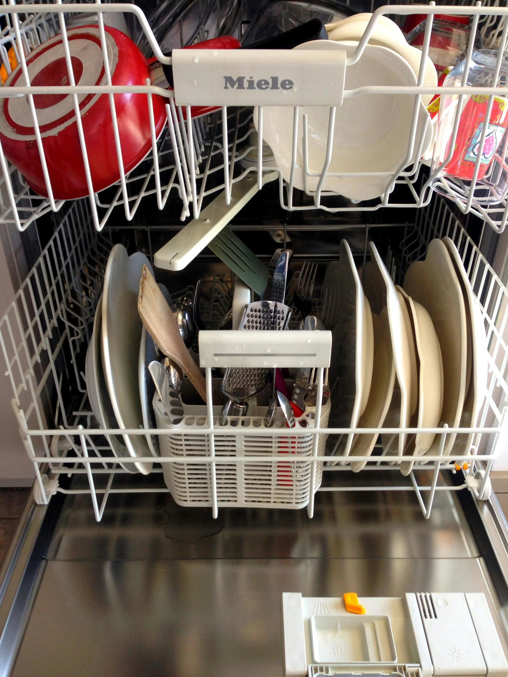 Open dishwasher representing a commonly recalled household appliance