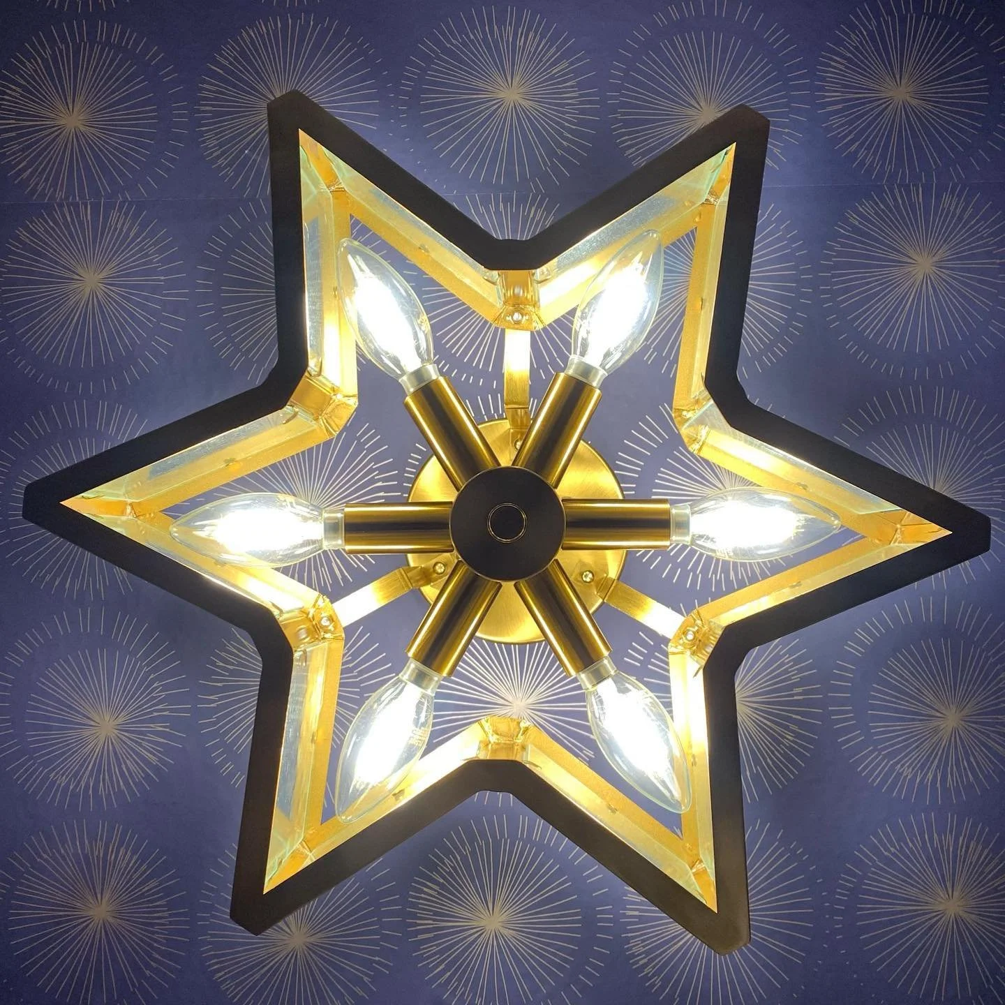  Image from Tempaper  The pattern in this one echoes the shape of the light fixture, but you don’t have to do it that way.  